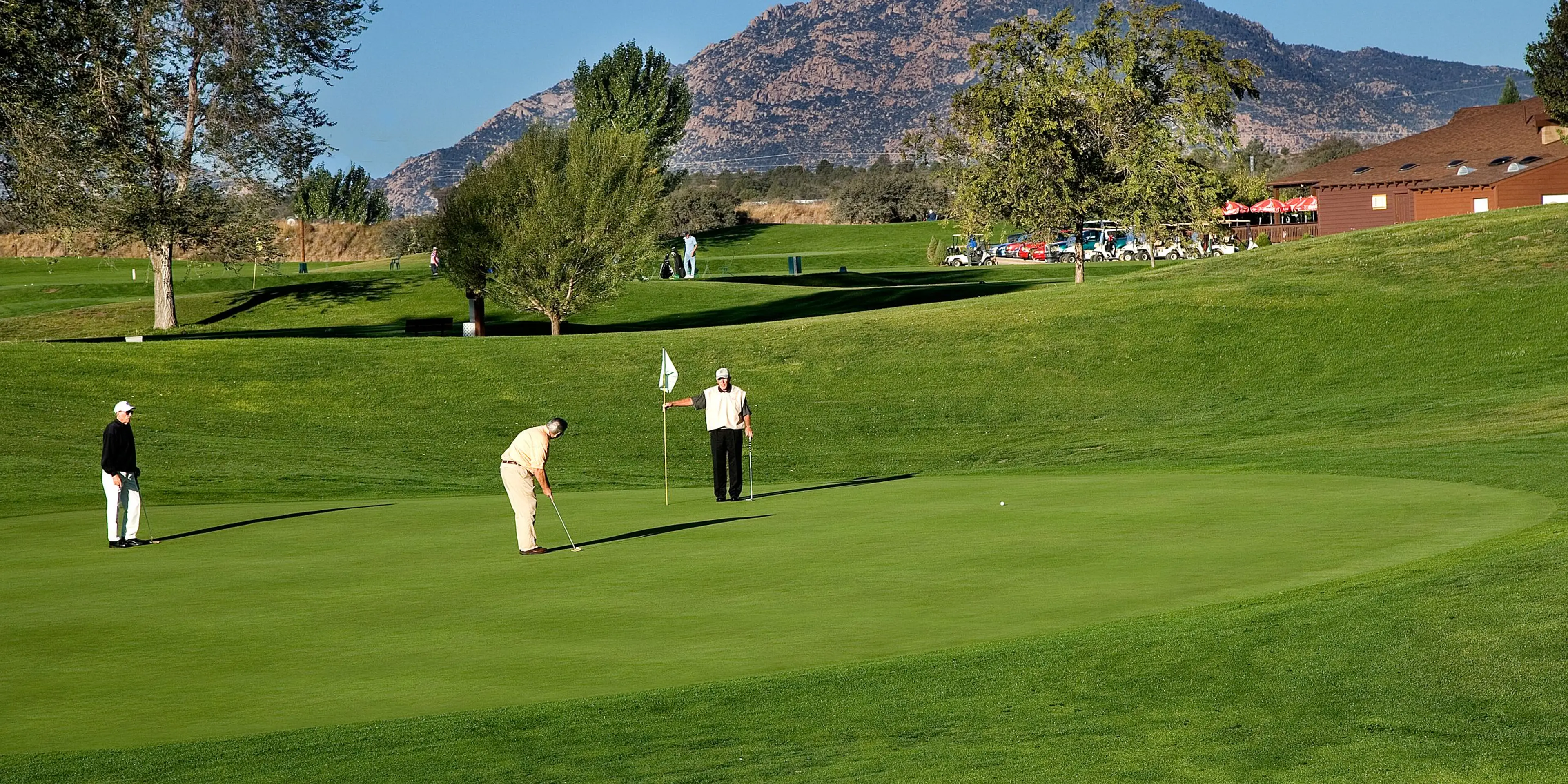Landscape putting greens and fairway photo of the Antelope Hills Golf Course golf course