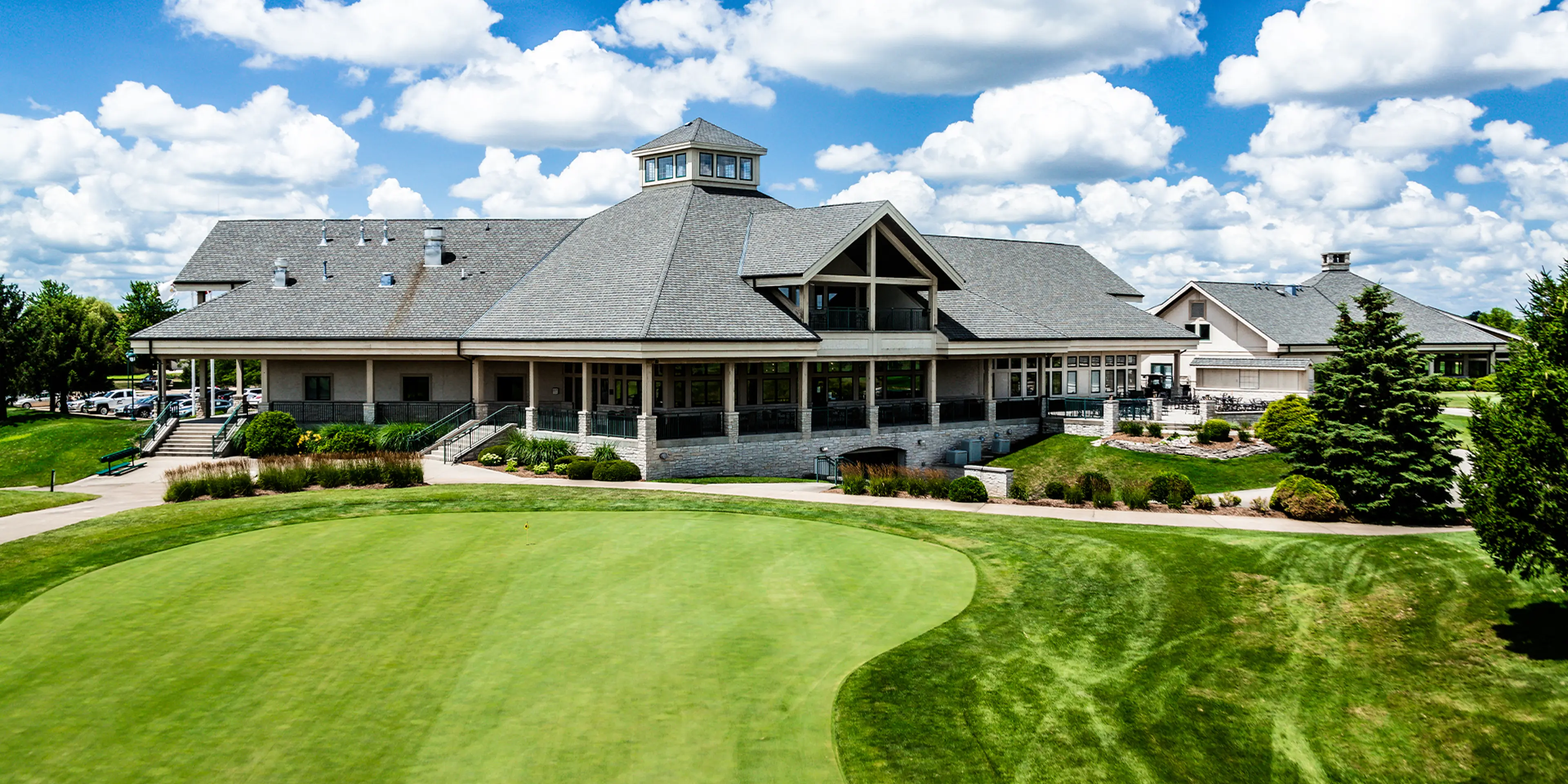 Landscape putting greens and fairway photo of the Atkins Golf Club golf course