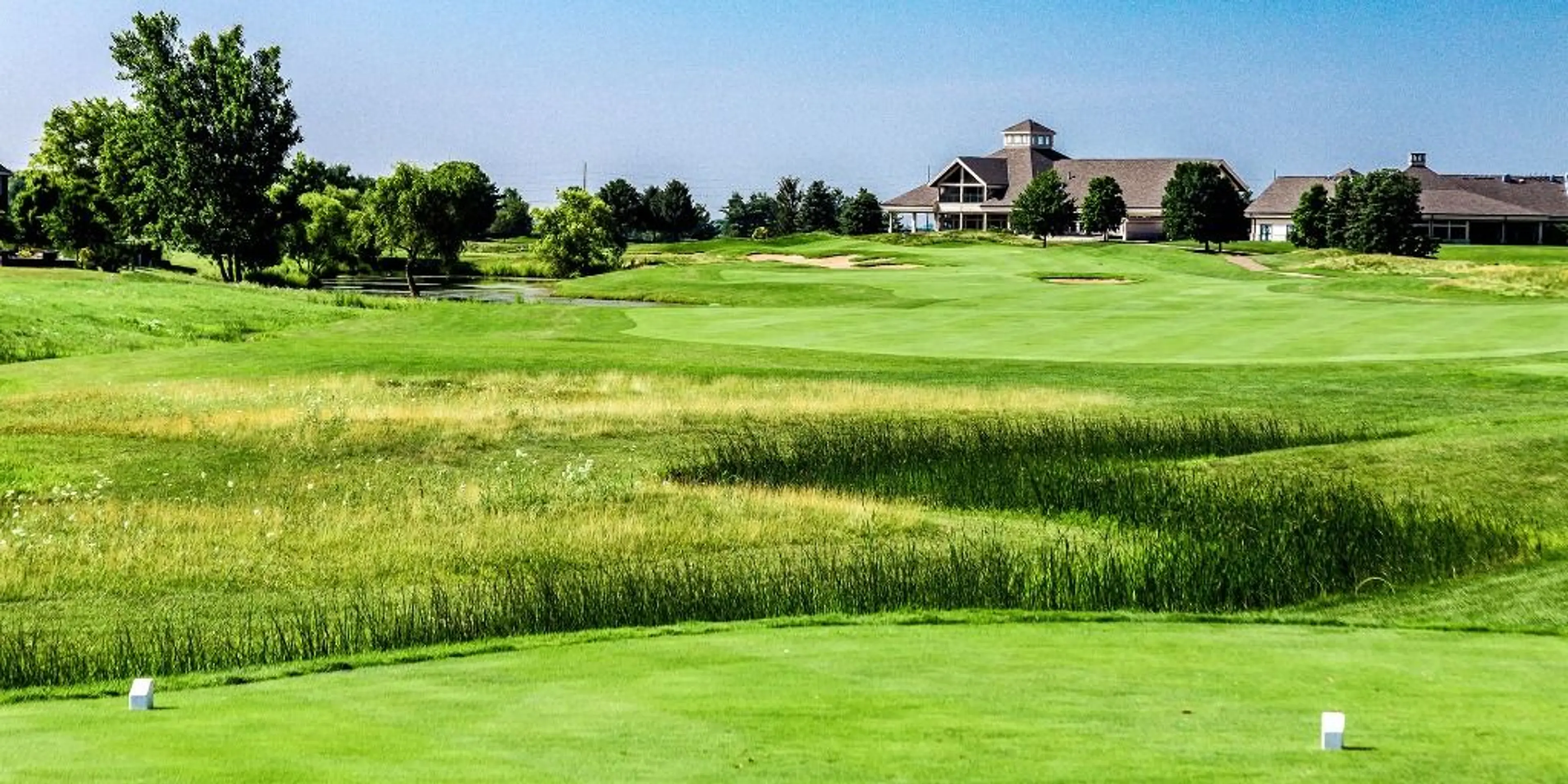 Landscape putting greens and fairway photo of the Atkins Golf Club golf course