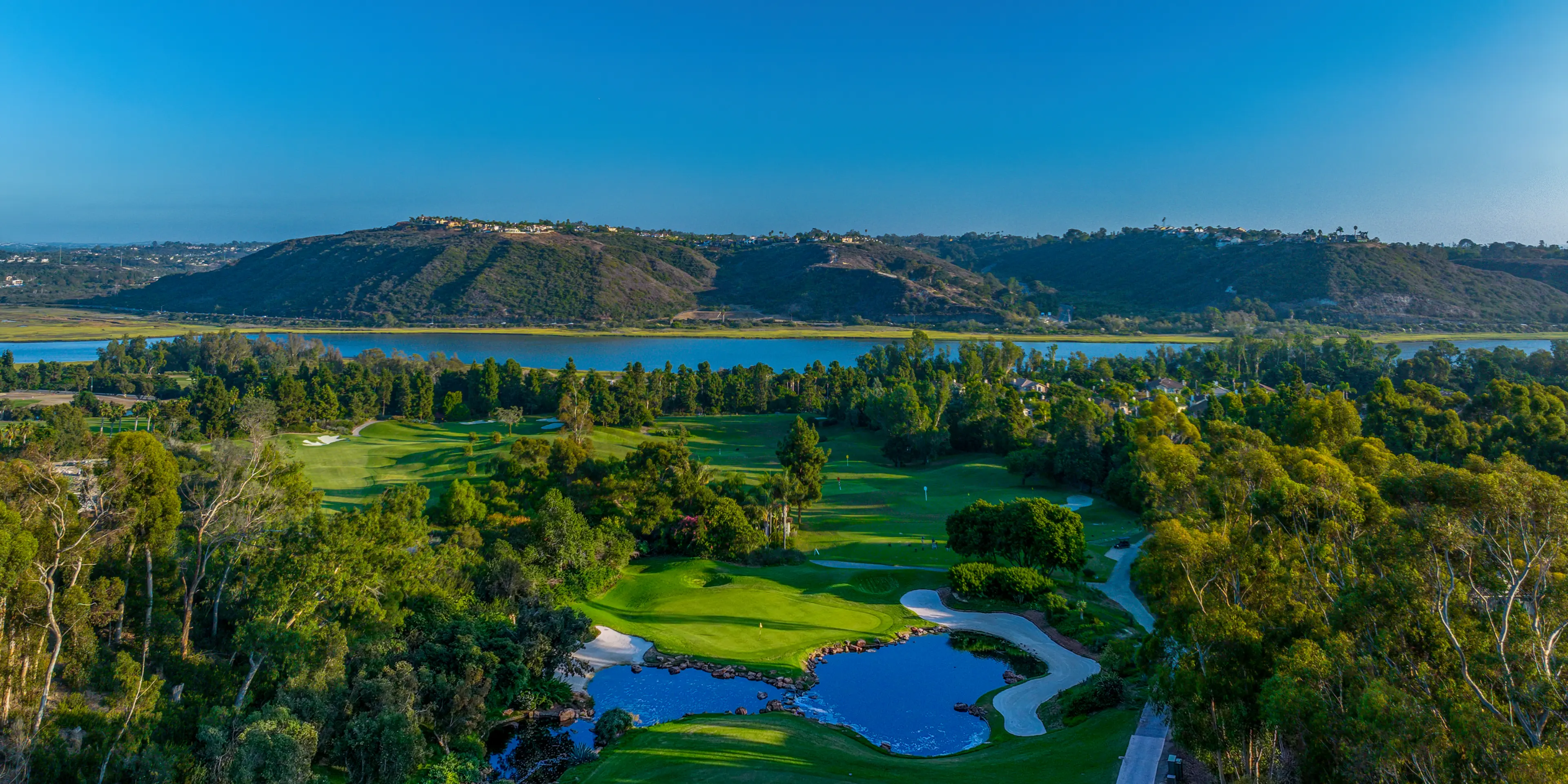 Landscape putting greens and fairway photo of the Aviara Golf Club golf course