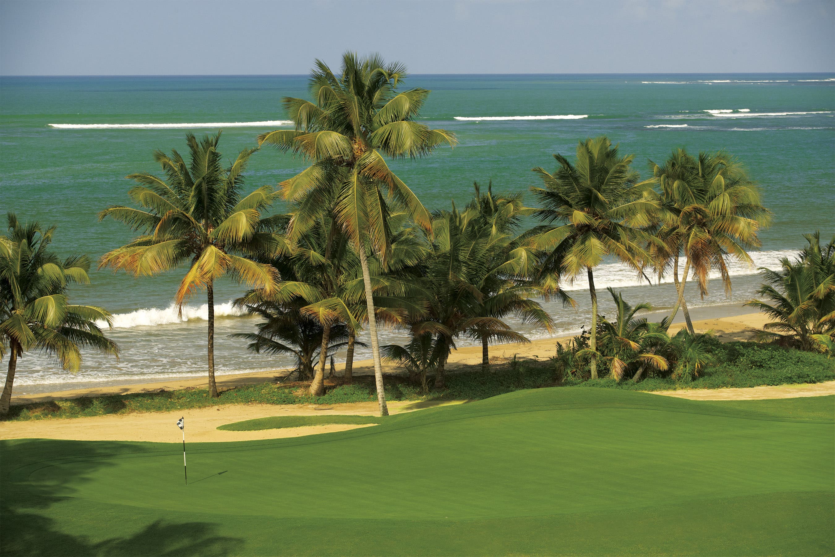 Landscape putting greens and fairway photo of the Bahia Beach Resort & Golf Club golf course