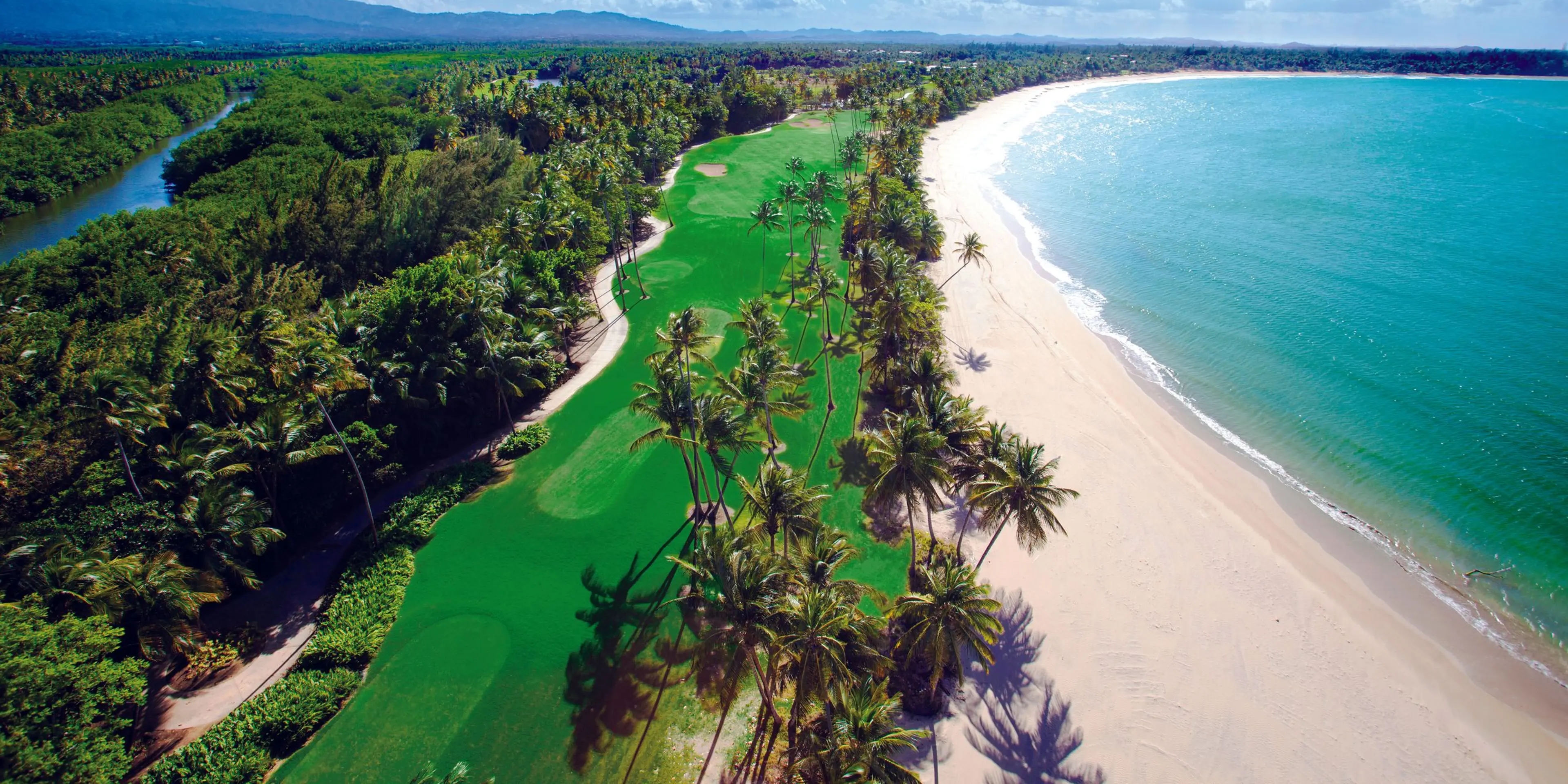 Landscape putting greens and fairway photo of the Bahia Beach Resort & Golf Club golf course