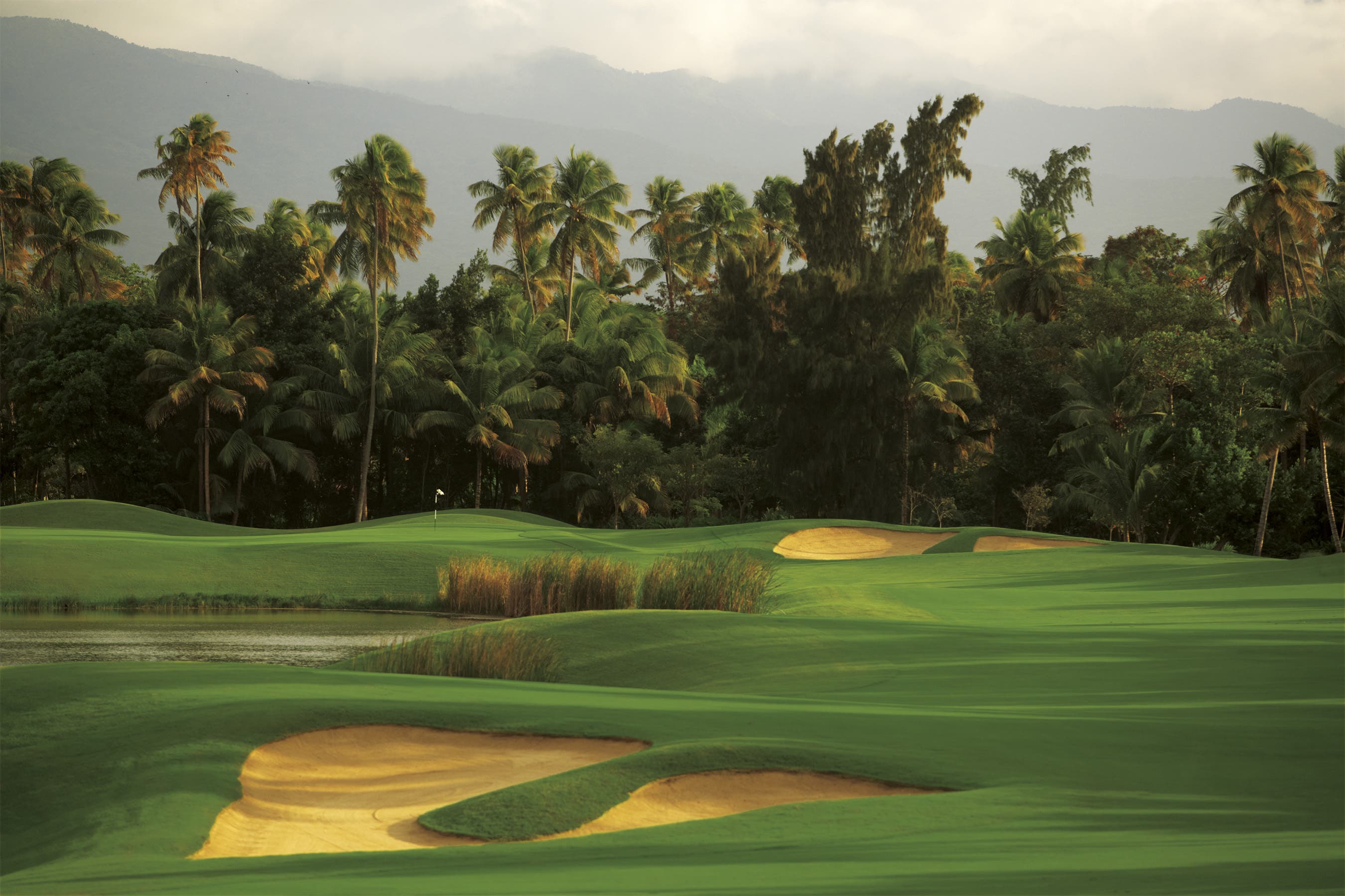 Landscape putting greens and fairway photo of the Bahia Beach Resort & Golf Club golf course