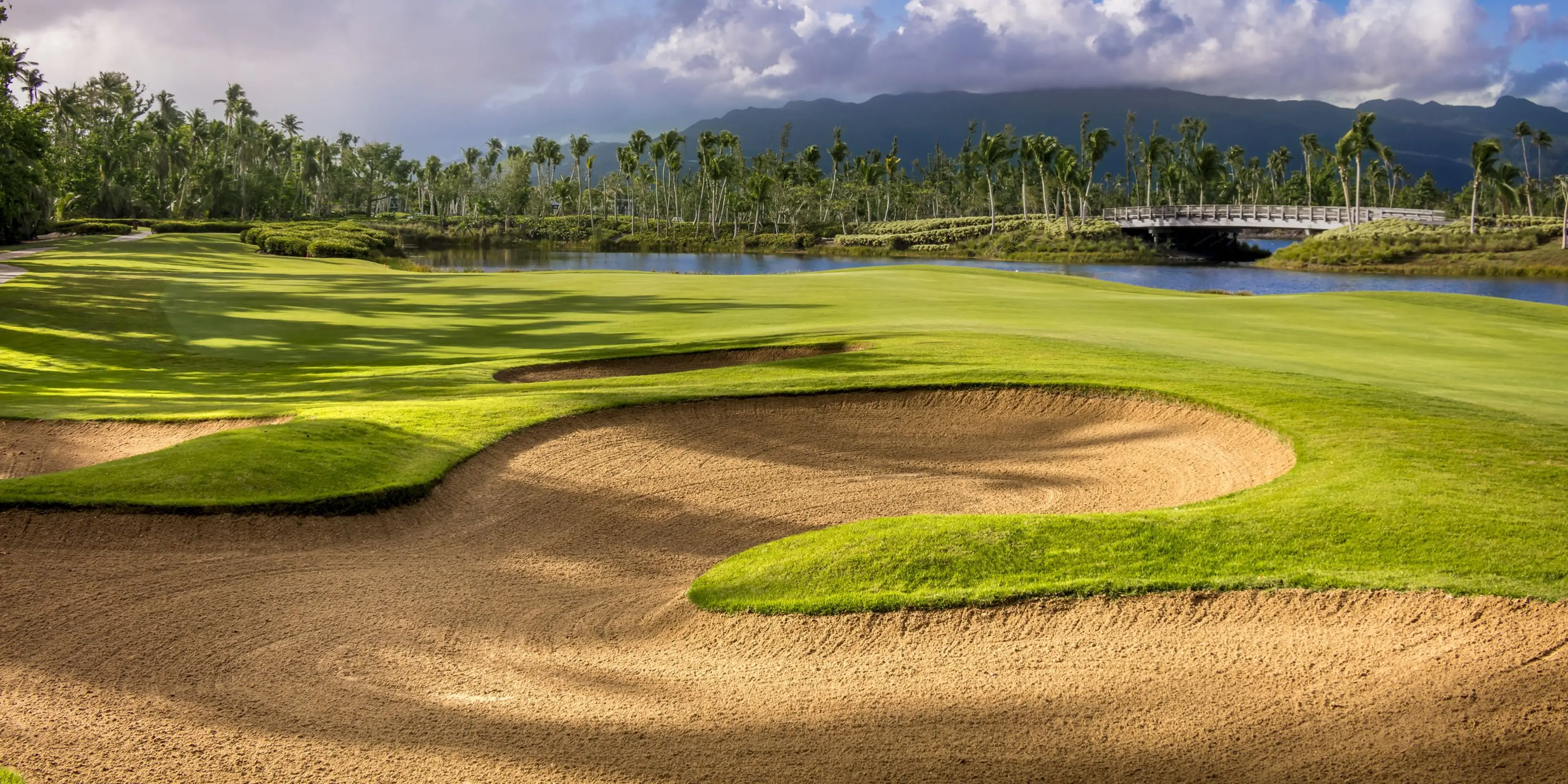 Landscape putting greens and fairway photo of the Bahia Beach Resort & Golf Club golf course