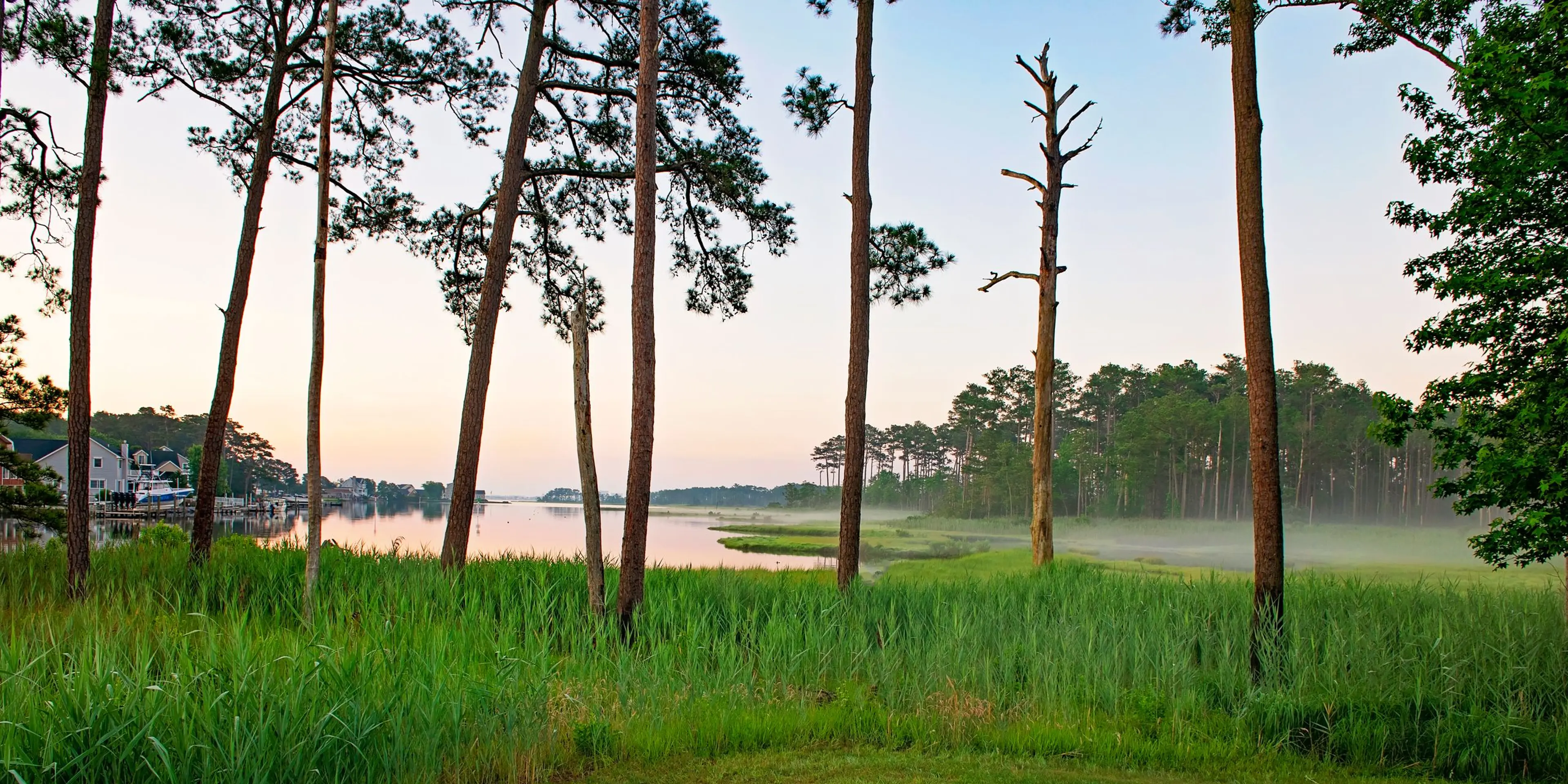Landscape putting greens and fairway photo of the Bayside Resort Golf Club golf course