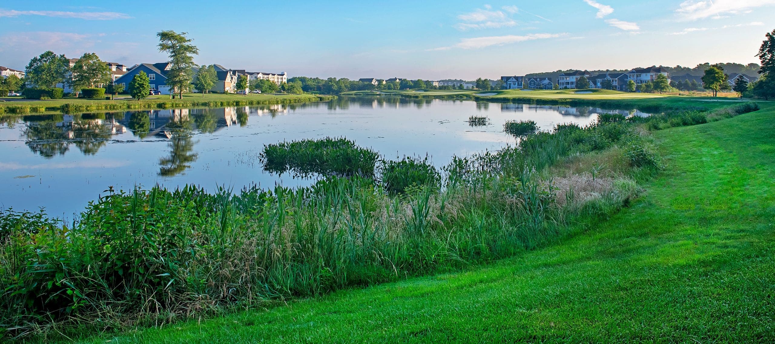 Landscape putting greens and fairway photo of the Bayside Resort Golf Club golf course