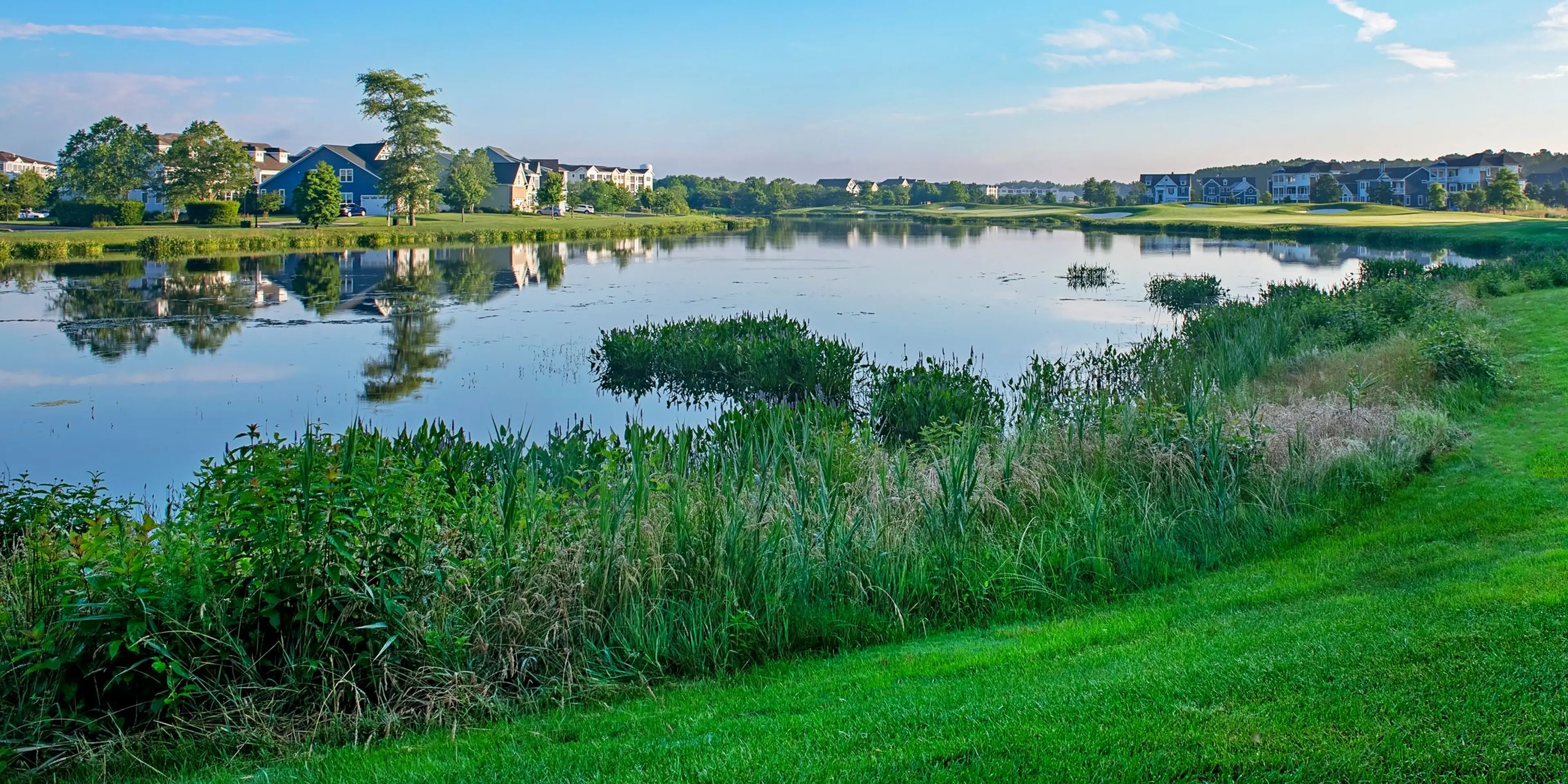Landscape putting greens and fairway photo of the Bayside Resort Golf Club golf course