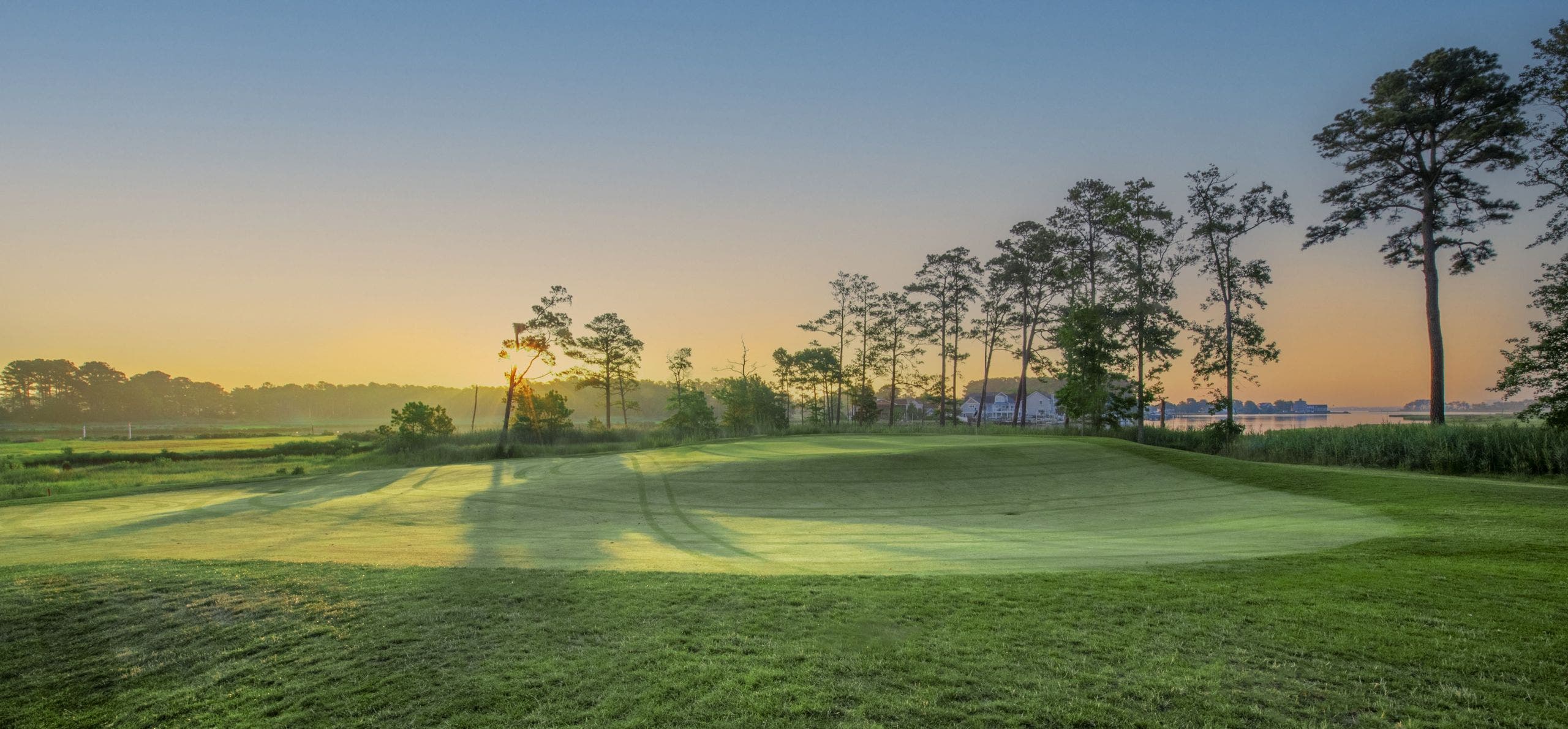 Landscape putting greens and fairway photo of the Bayside Resort Golf Club golf course