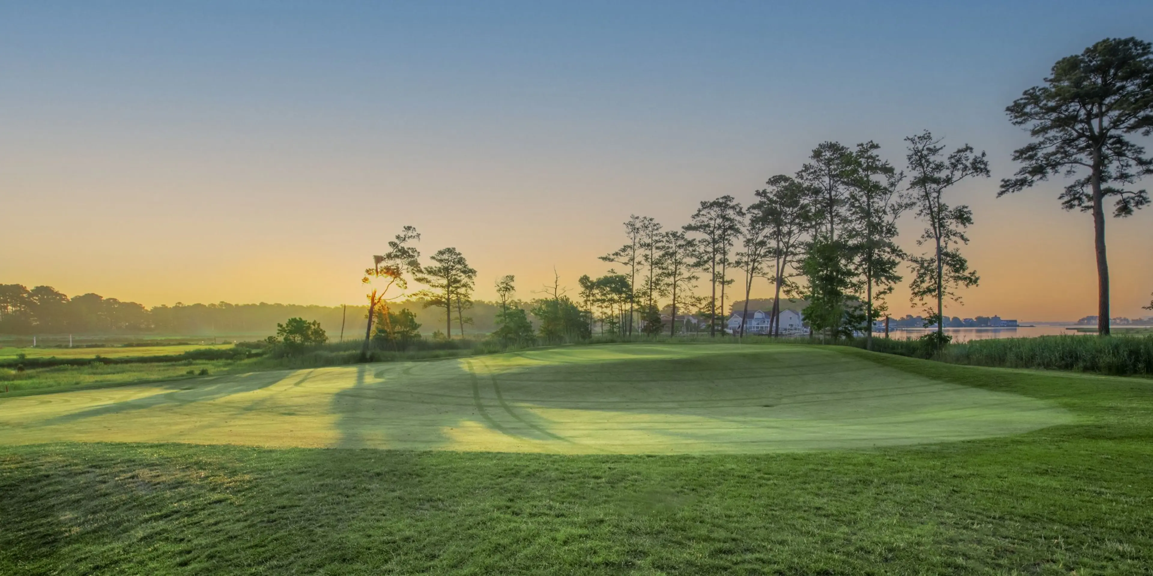 Landscape putting greens and fairway photo of the Bayside Resort Golf Club golf course