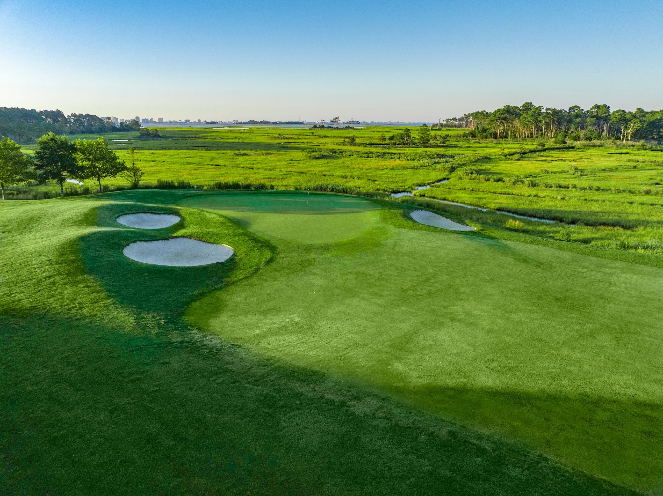 Landscape putting greens and fairway photo of the Bayside Resort Golf Club golf course