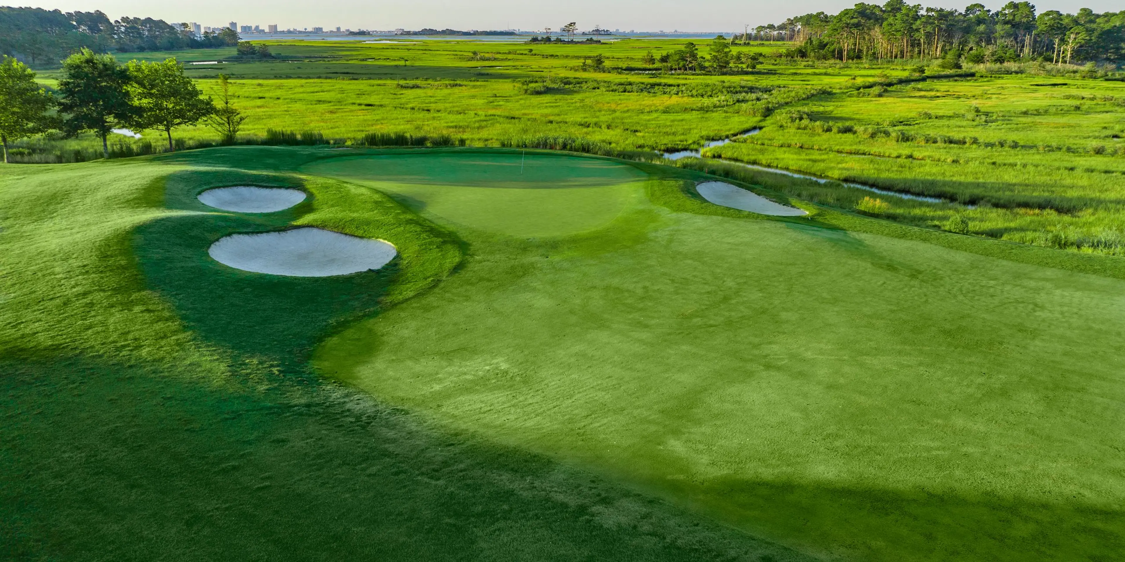 Landscape putting greens and fairway photo of the Bayside Resort Golf Club golf course