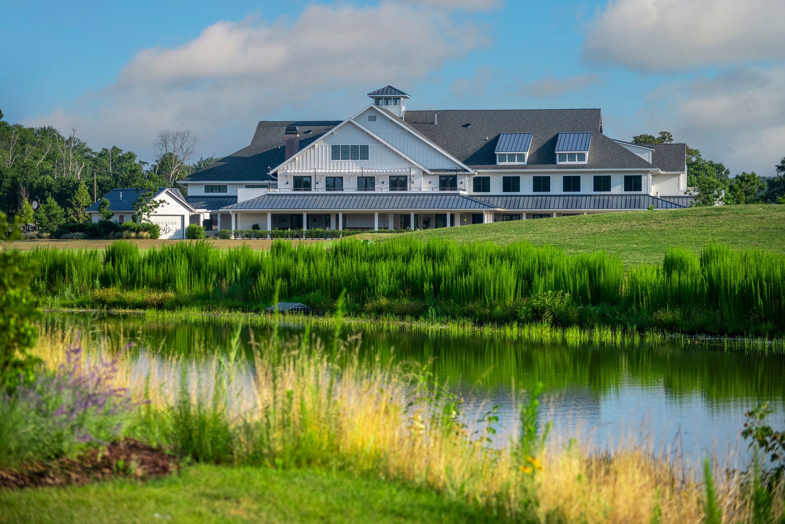 Landscape putting greens and fairway photo of the Bayside Resort Golf Club golf course