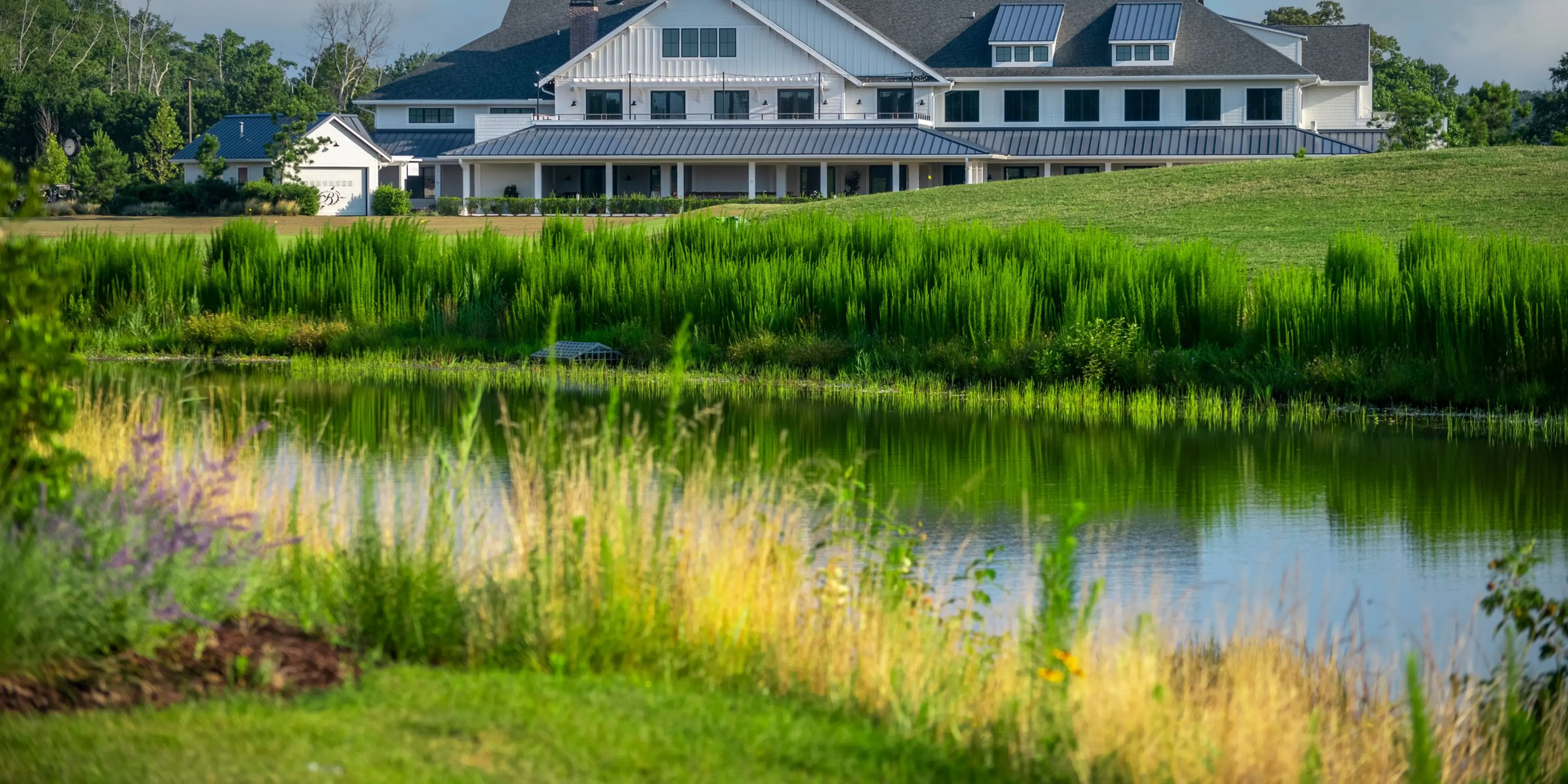 Landscape putting greens and fairway photo of the Bayside Resort Golf Club golf course