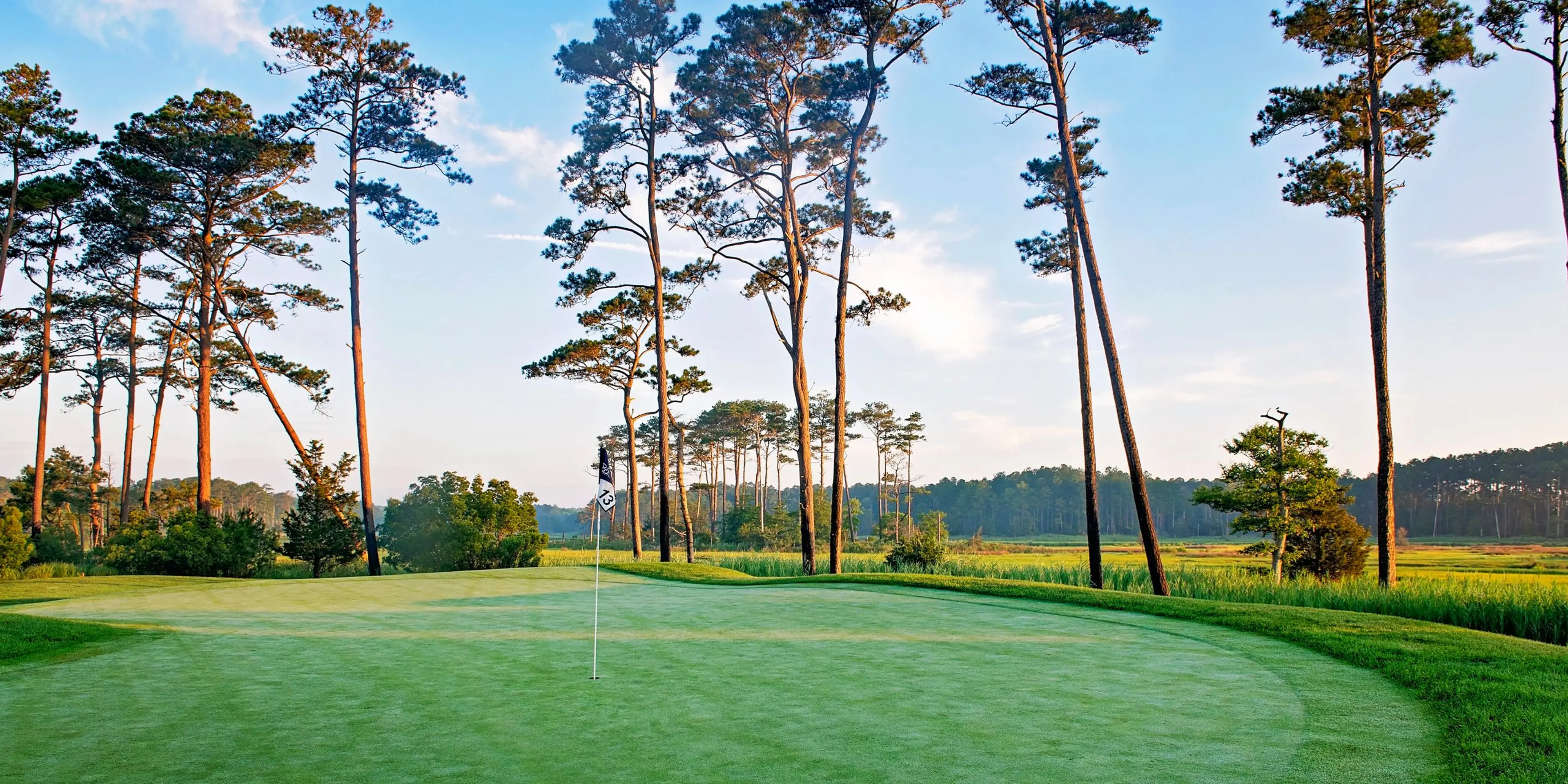 Landscape putting greens and fairway photo of the Bayside Resort Golf Club golf course