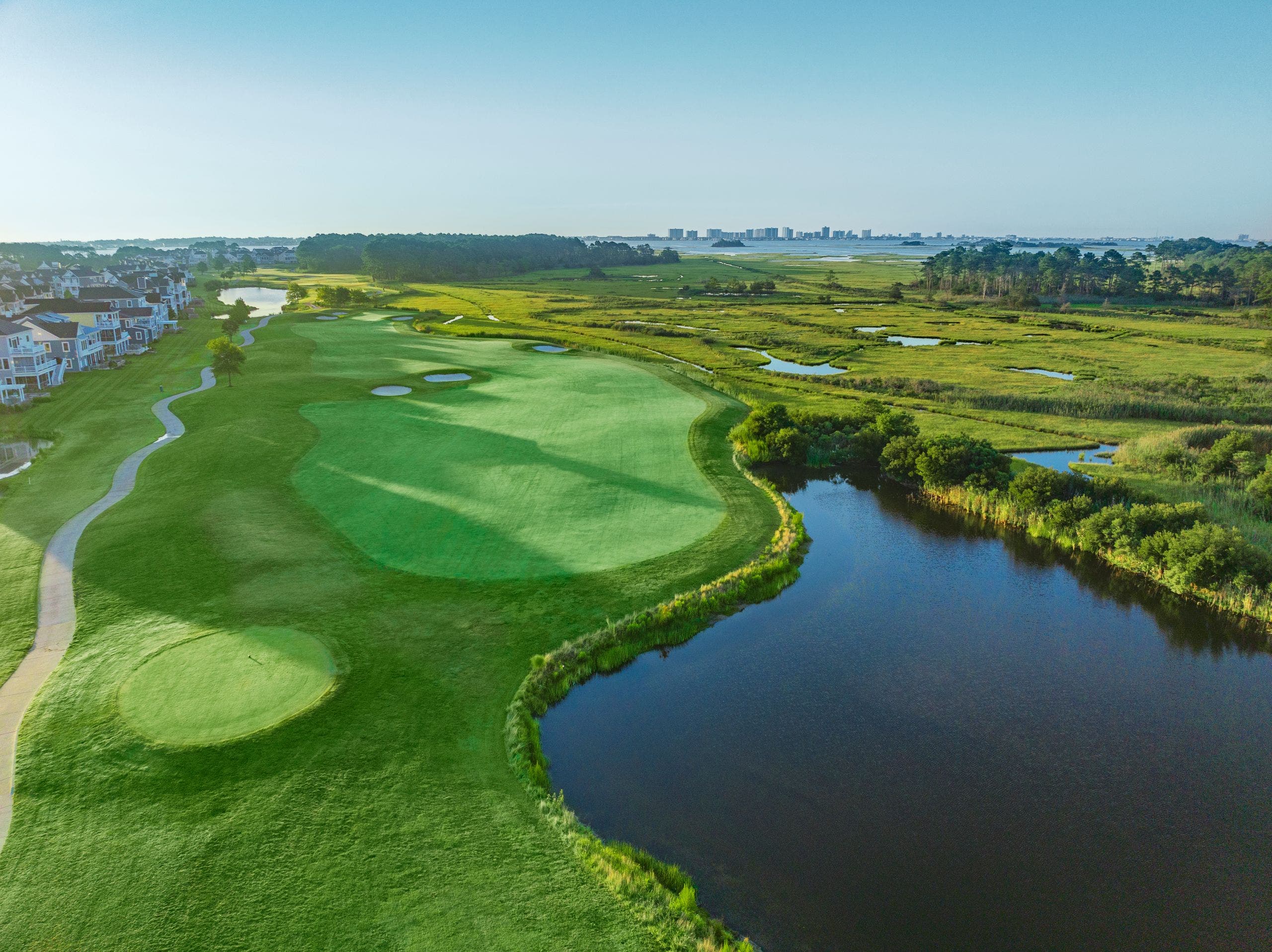 Landscape putting greens and fairway photo of the Bayside Resort Golf Club golf course