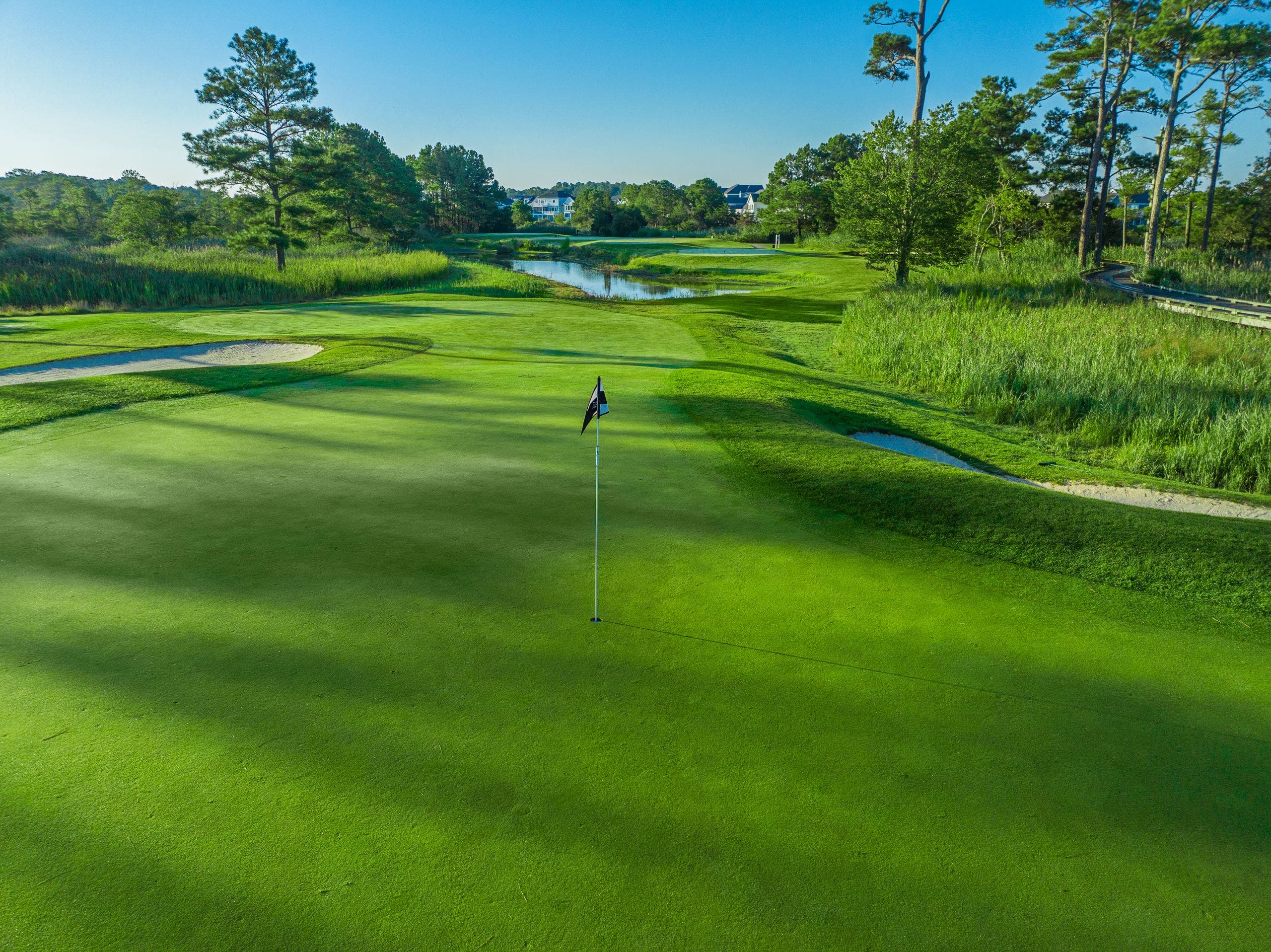 Landscape putting greens and fairway photo of the Bayside Resort Golf Club golf course