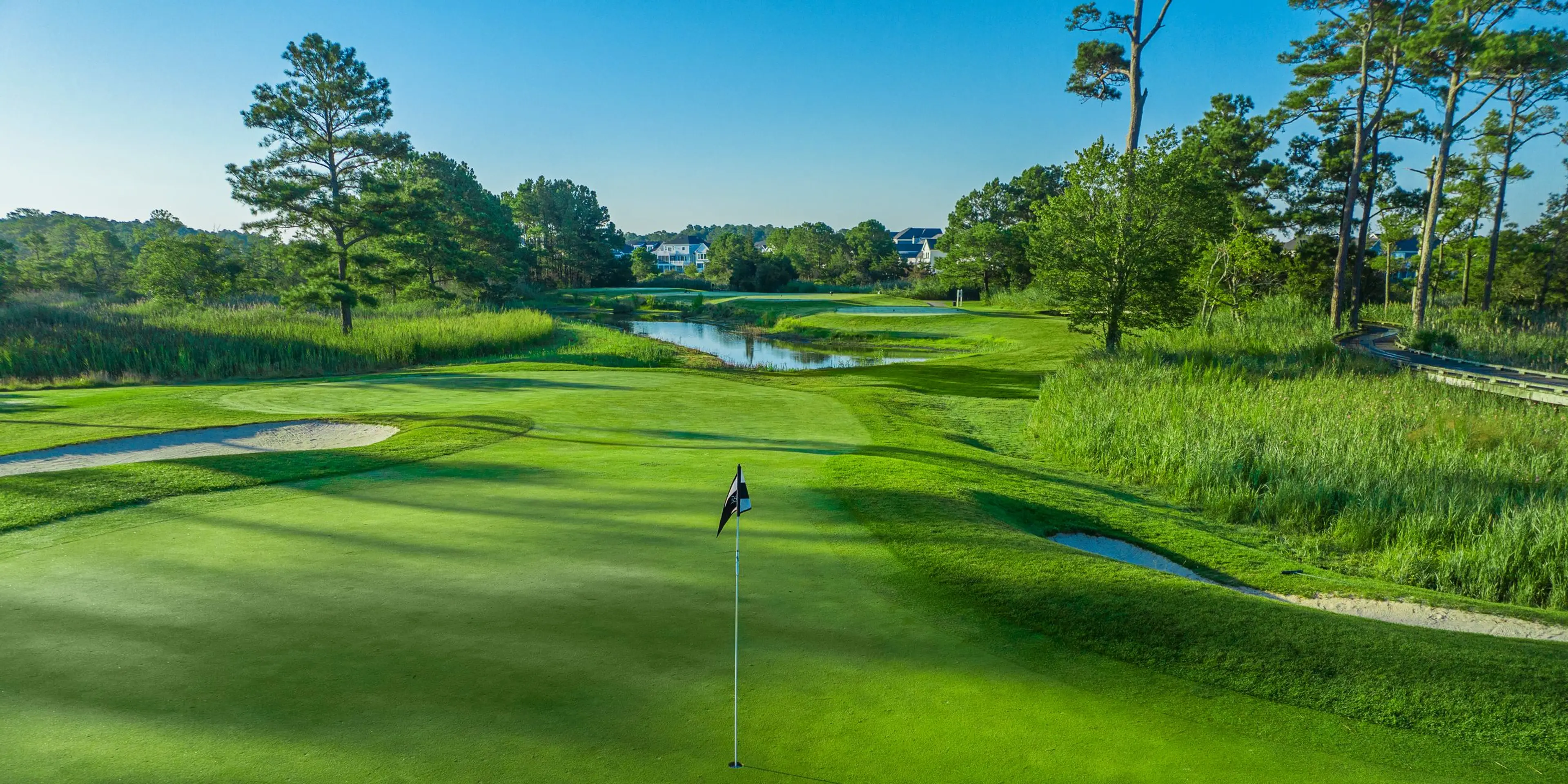 Landscape putting greens and fairway photo of the Bayside Resort Golf Club golf course