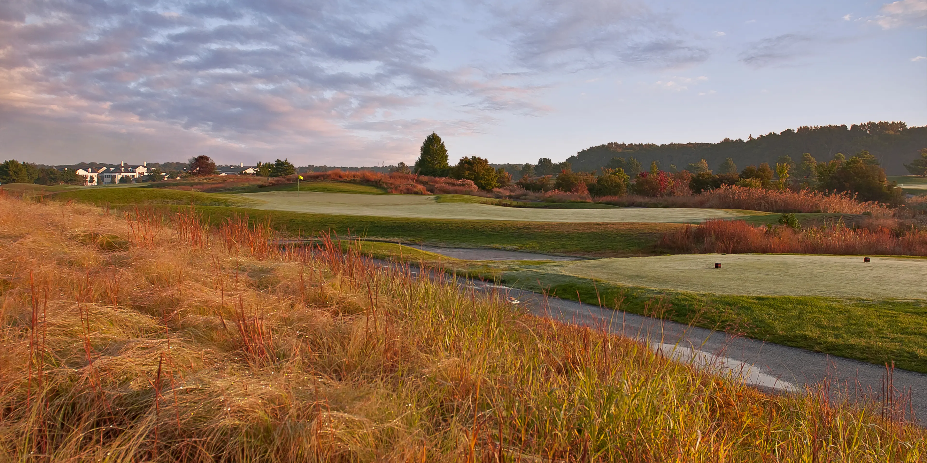 Landscape putting greens and fairway photo of the Bear Trap Dunes Golf Club golf course