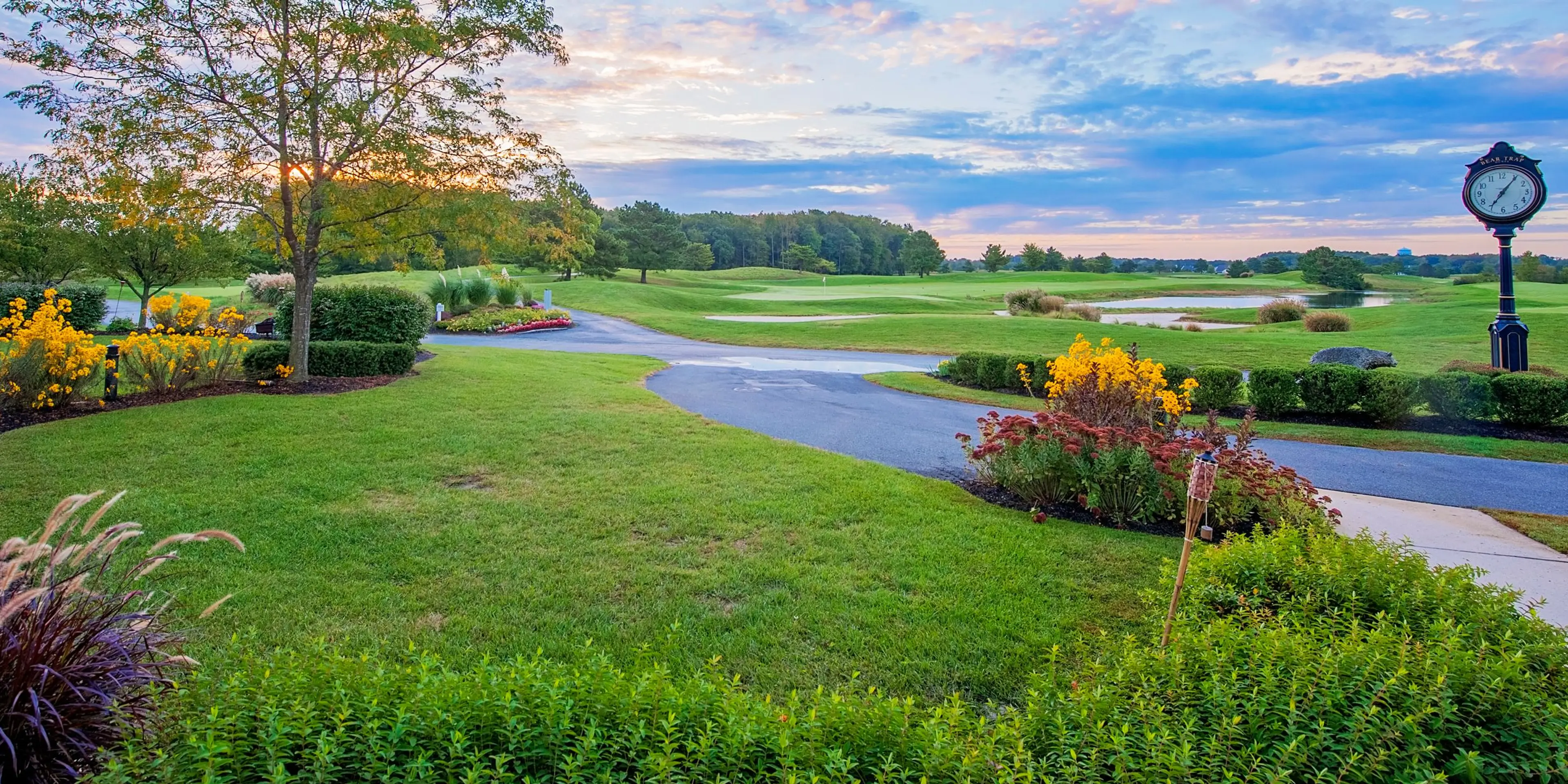 Landscape putting greens and fairway photo of the Bear Trap Dunes Golf Club golf course