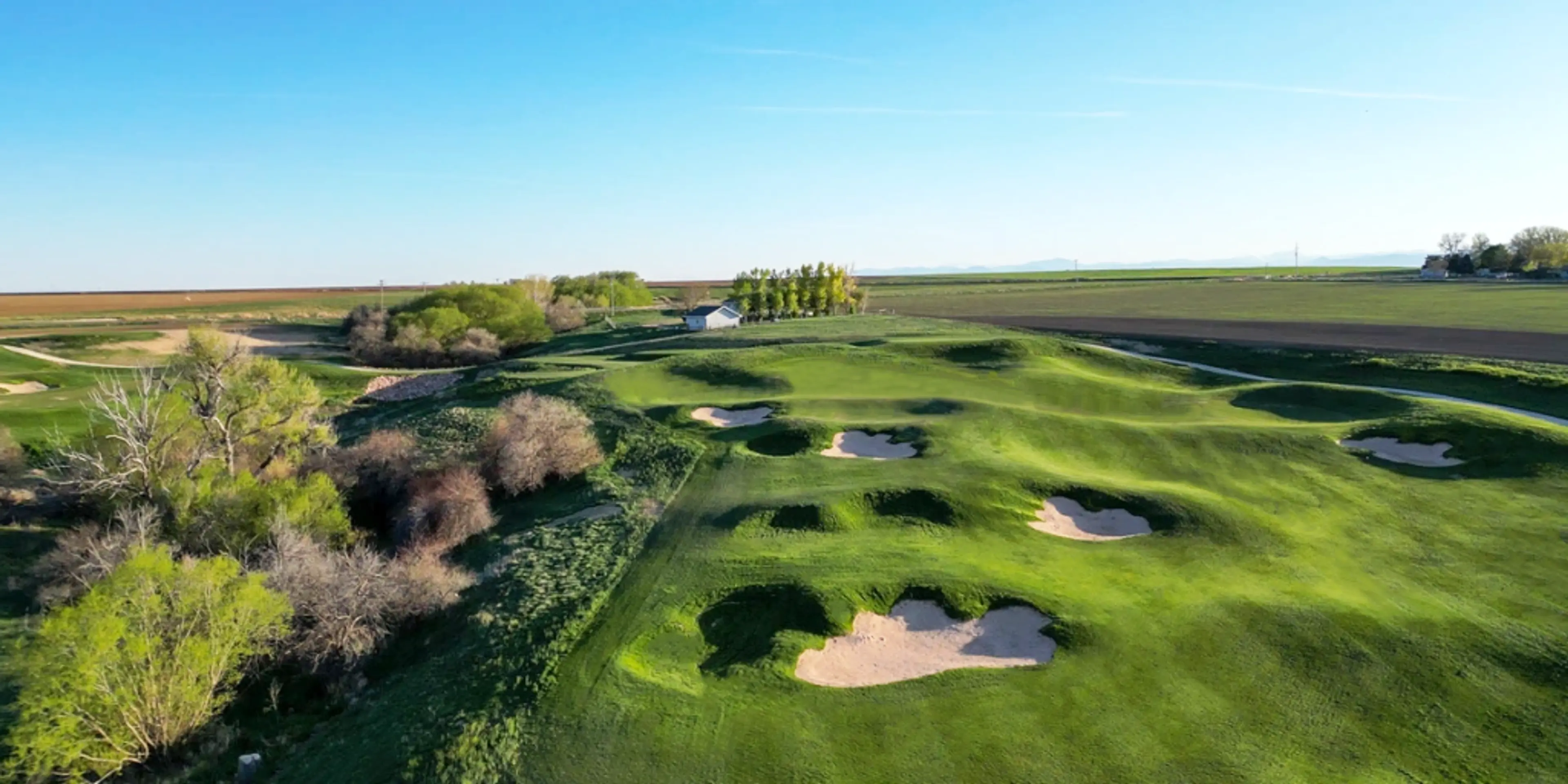 Landscape putting greens and fairway photo of the Bella Ridge Golf Club golf course