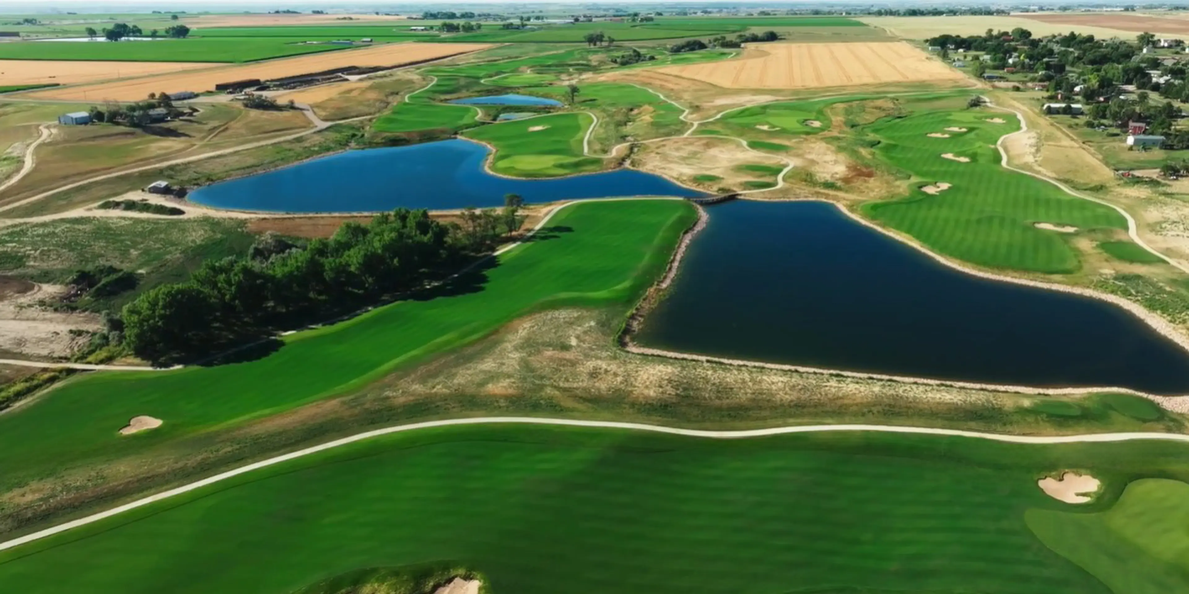 Landscape putting greens and fairway photo of the Bella Ridge Golf Club golf course