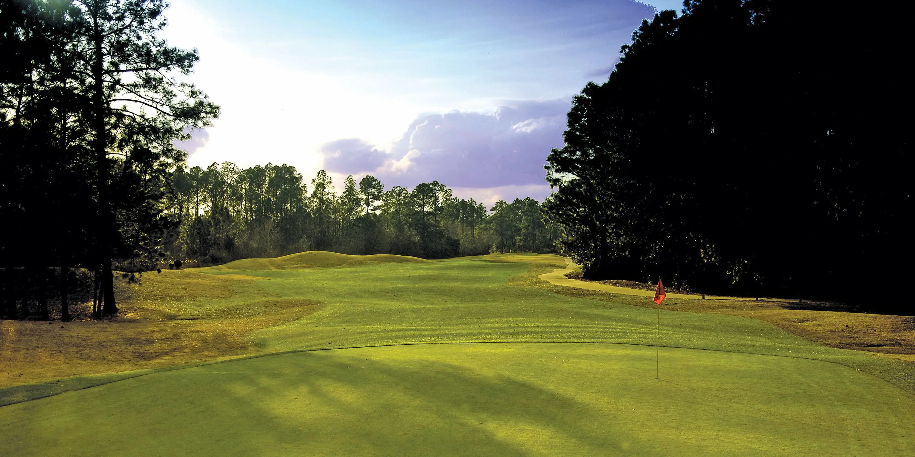 Landscape putting greens and fairway photo of the Bent Creek Golf Course golf course