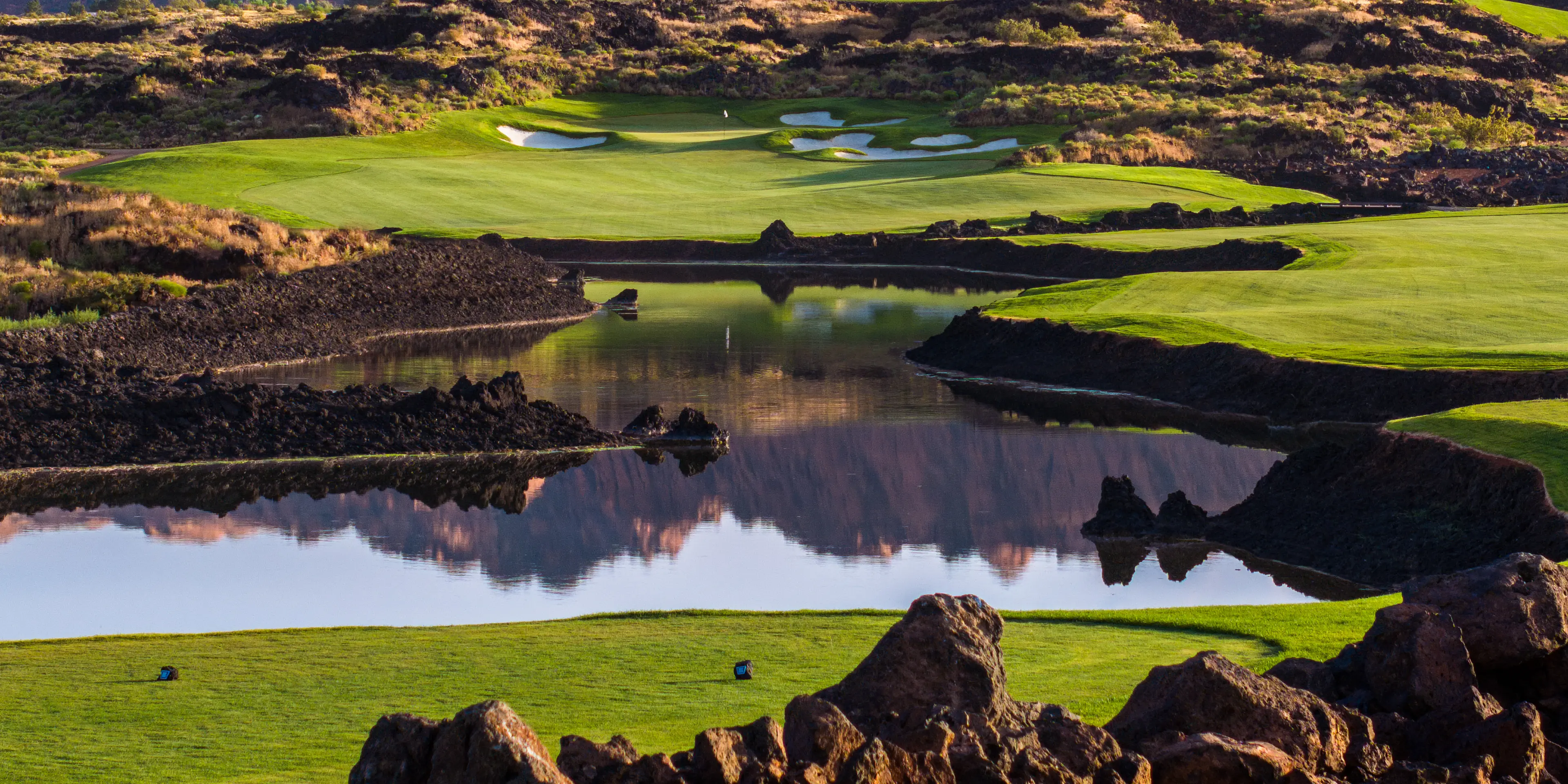 Landscape putting greens and fairway photo of the Black Desert golf course