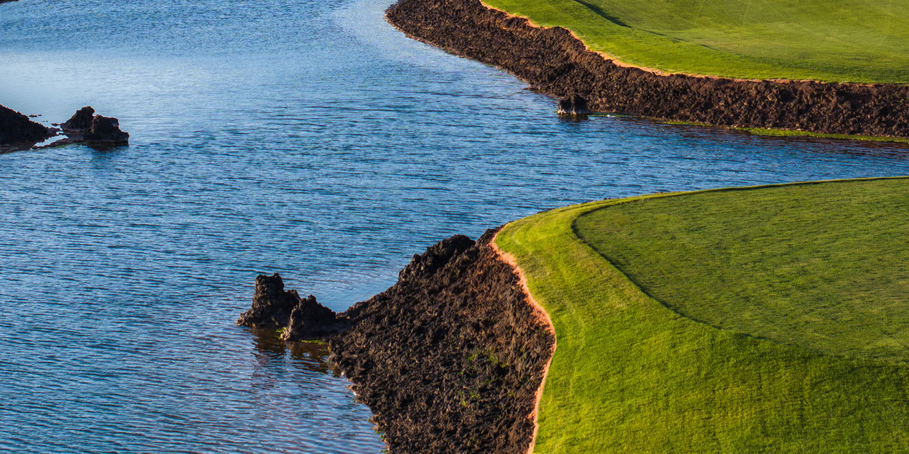 Landscape putting greens and fairway photo of the Black Desert golf course