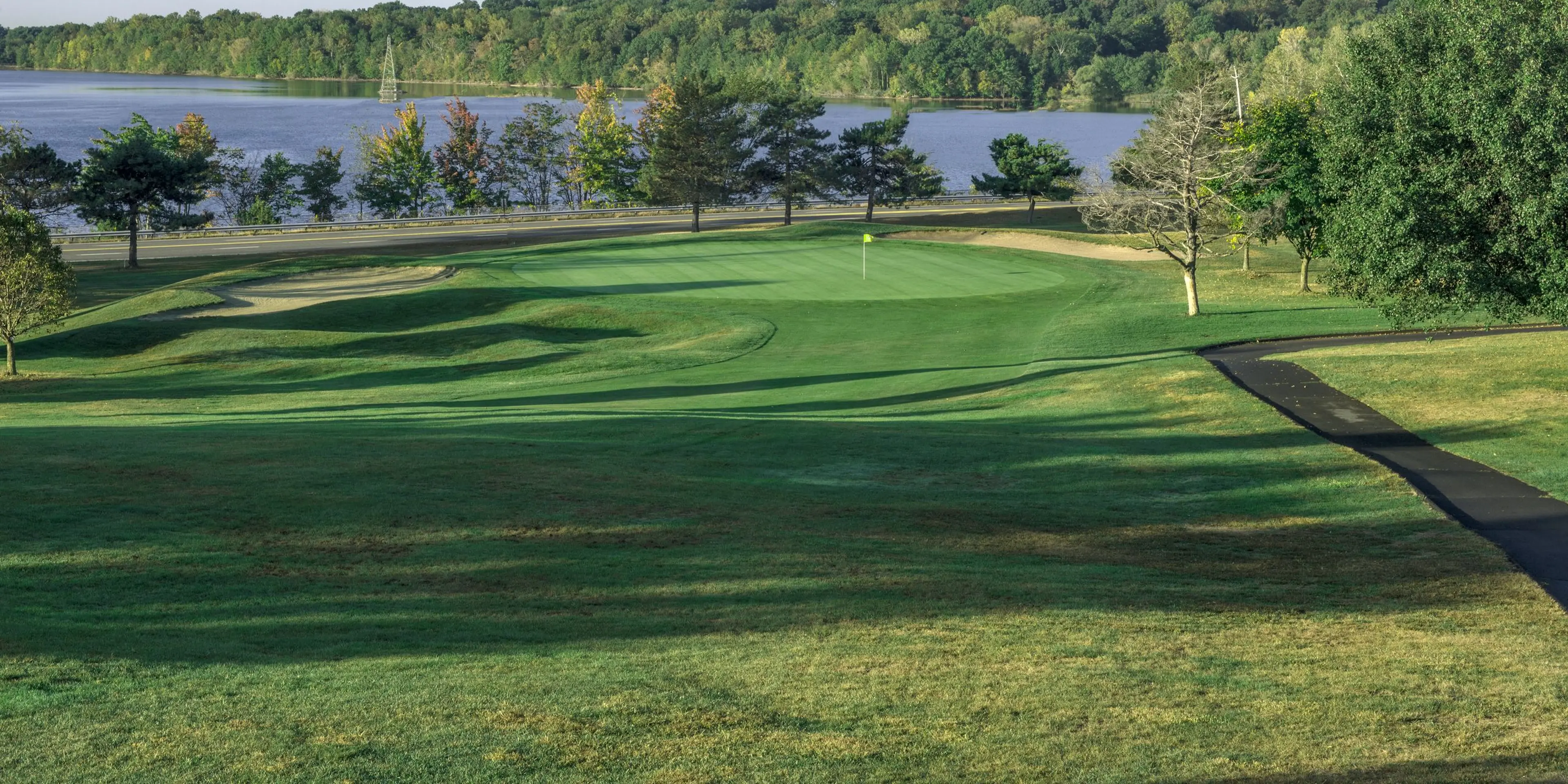Landscape putting greens and fairway photo of the Blue Hill Golf Course golf course