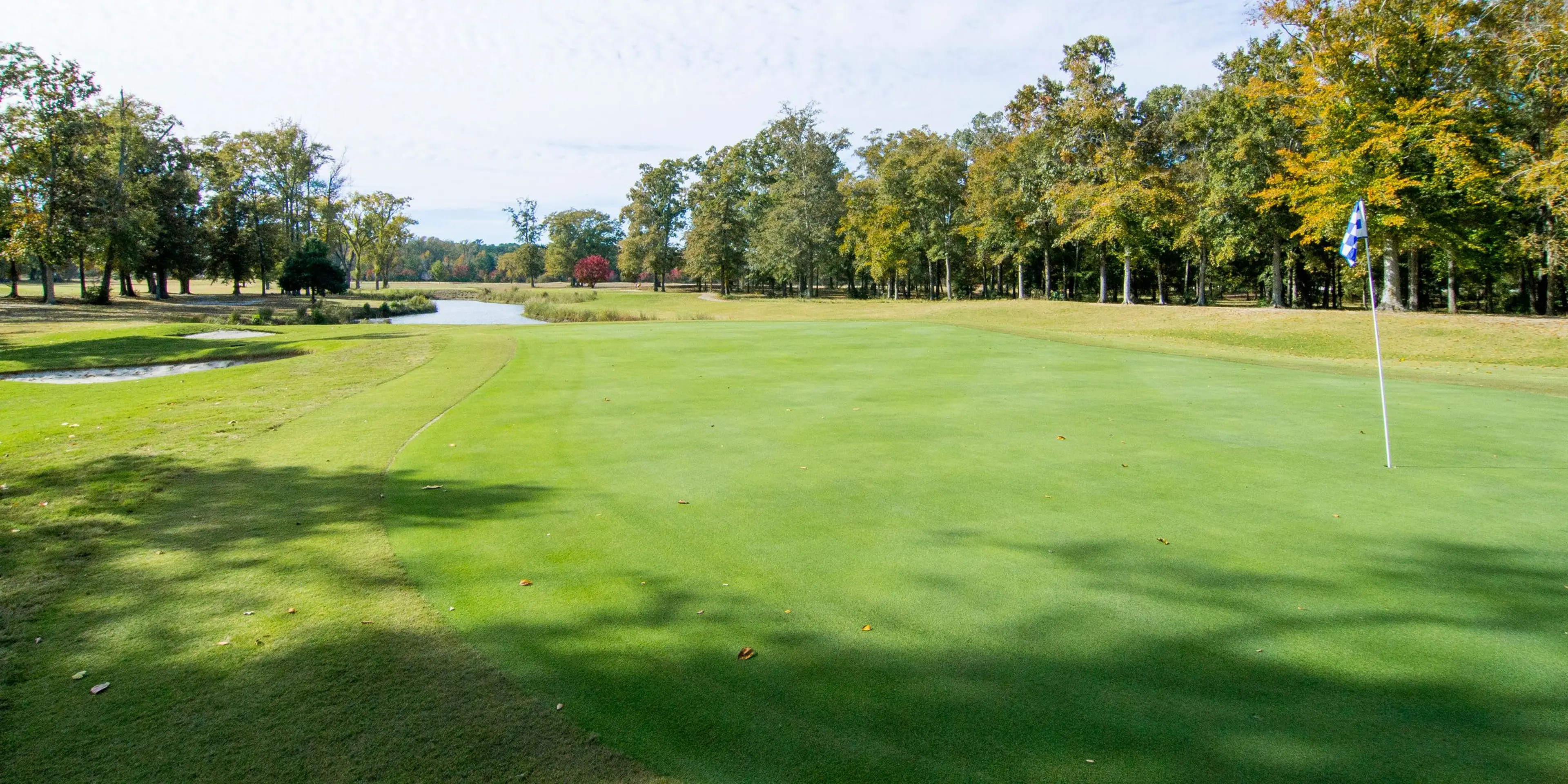 Landscape putting greens and fairway photo of the Bradford Creek Golf Course golf course