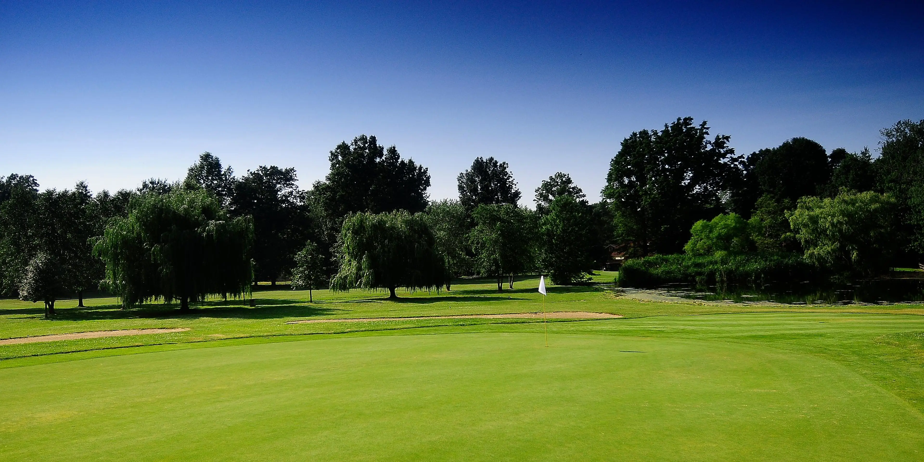 Landscape putting greens and fairway photo of the Briardale Greens Golf Course golf course