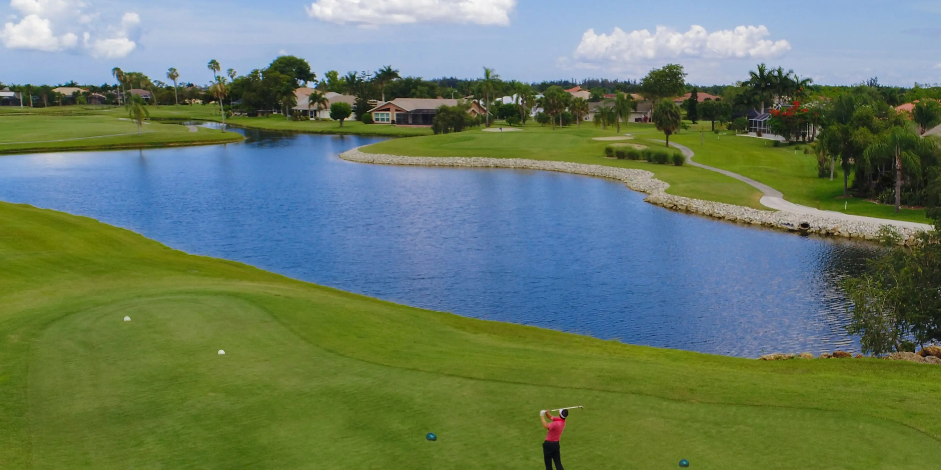 Landscape putting greens and fairway photo of the Cape Royal Golf Club golf course