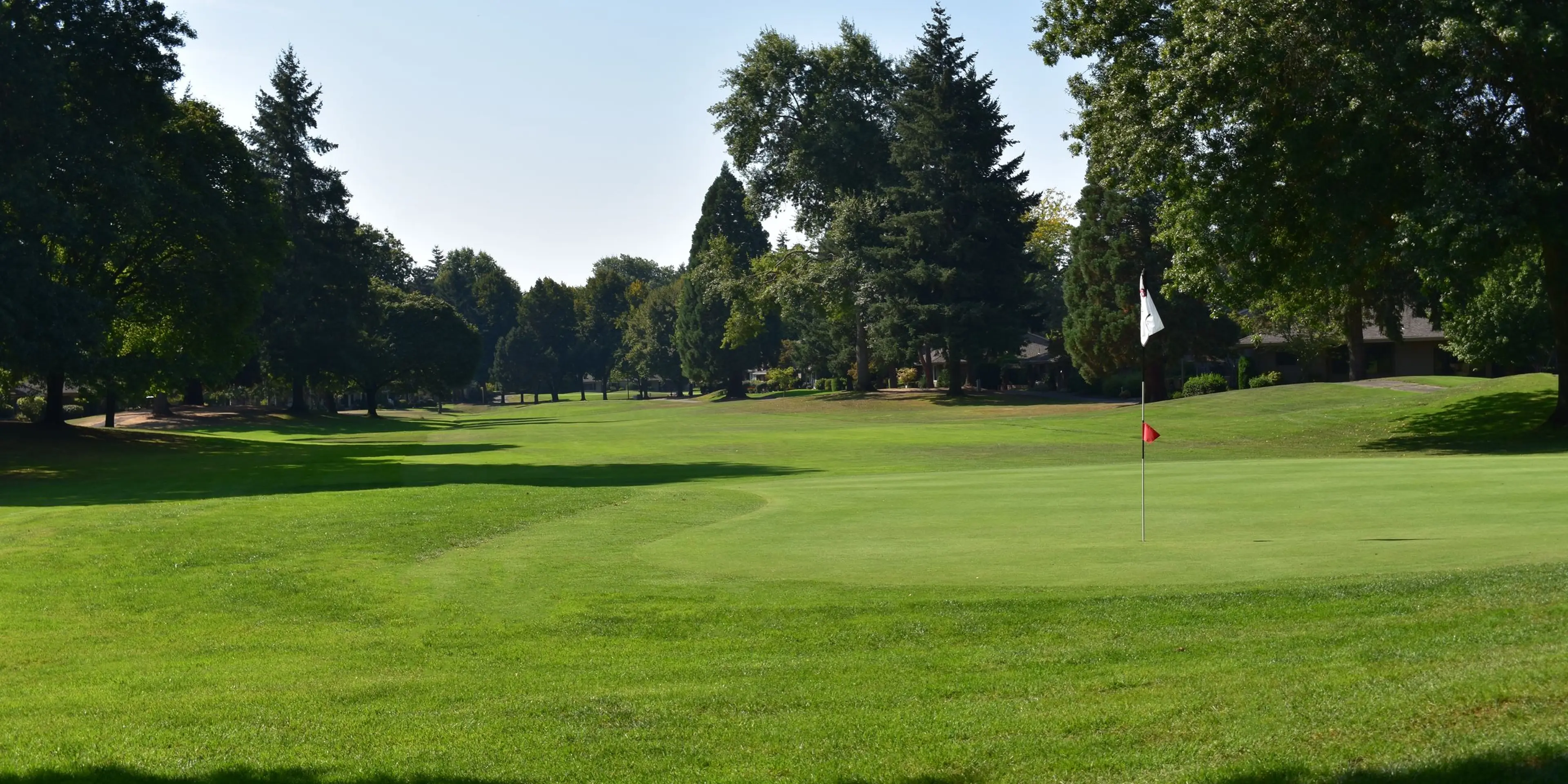 Landscape putting greens and fairway photo of the Charbonneau Golf Club golf course