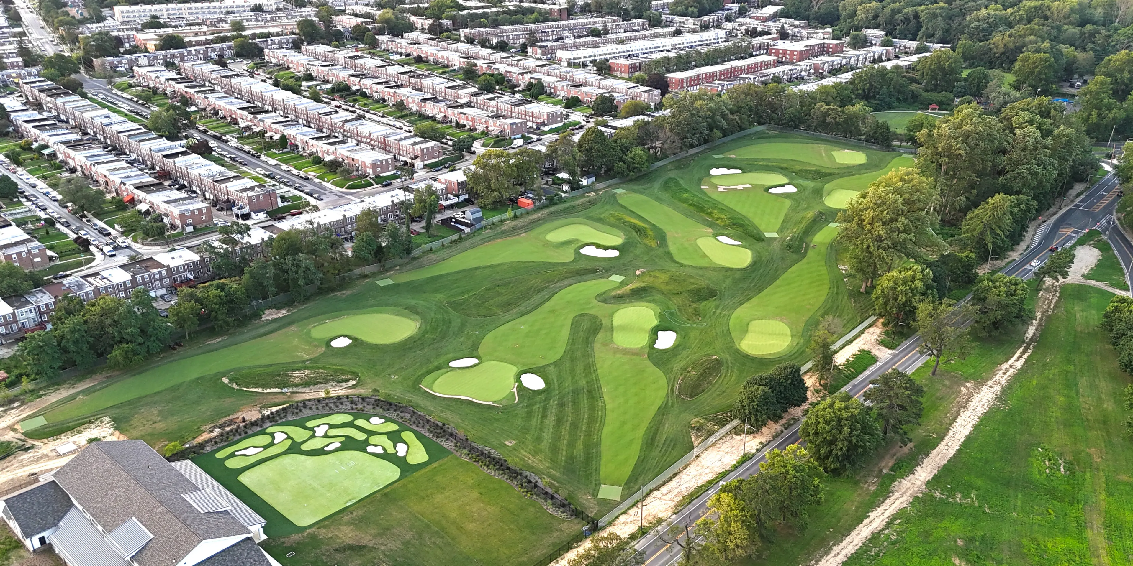 Landscape putting greens and fairway photo of the Cobbs Creek Golf Campus golf course