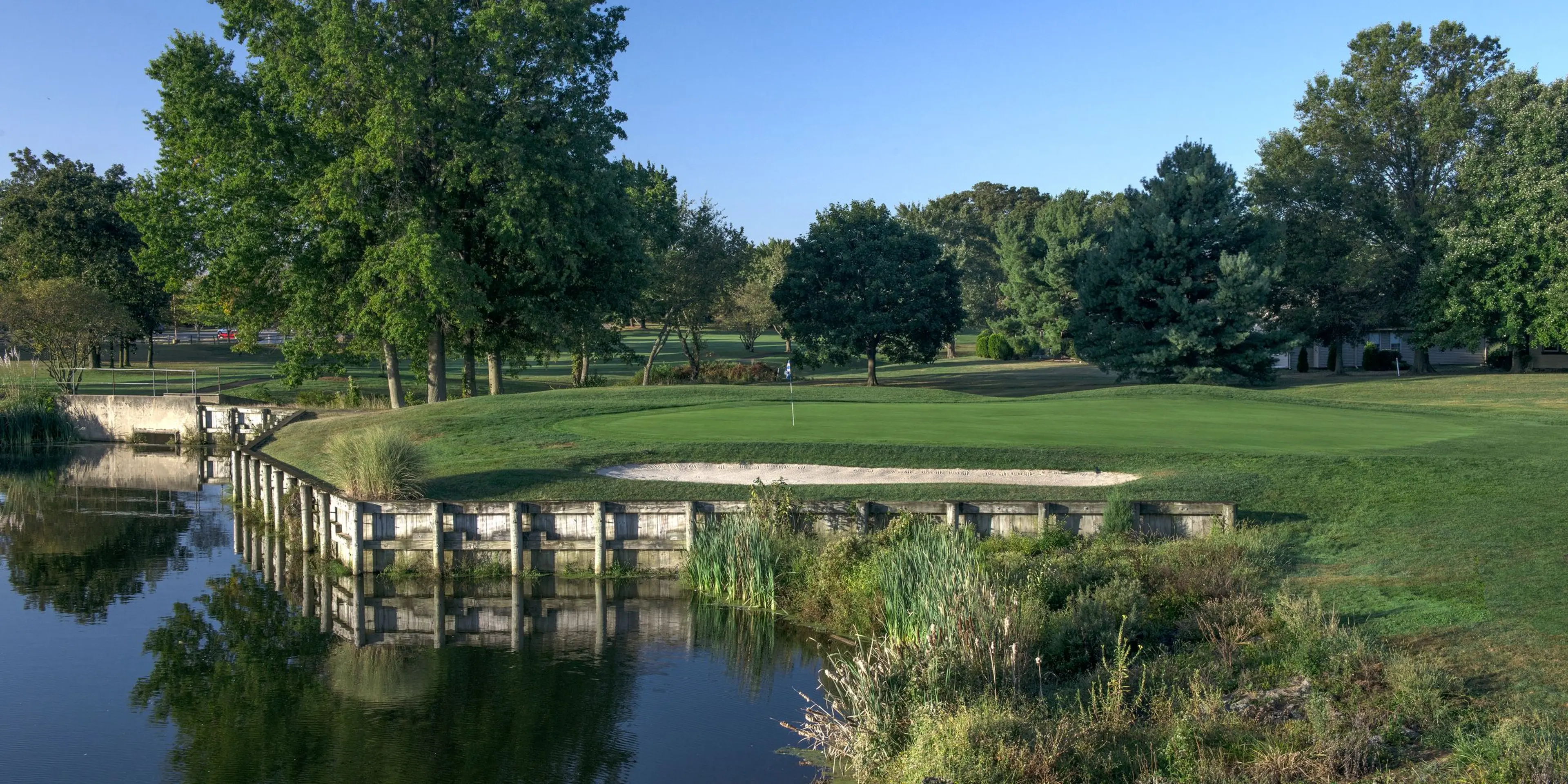 Landscape putting greens and fairway photo of the Concordia Golf Club golf course