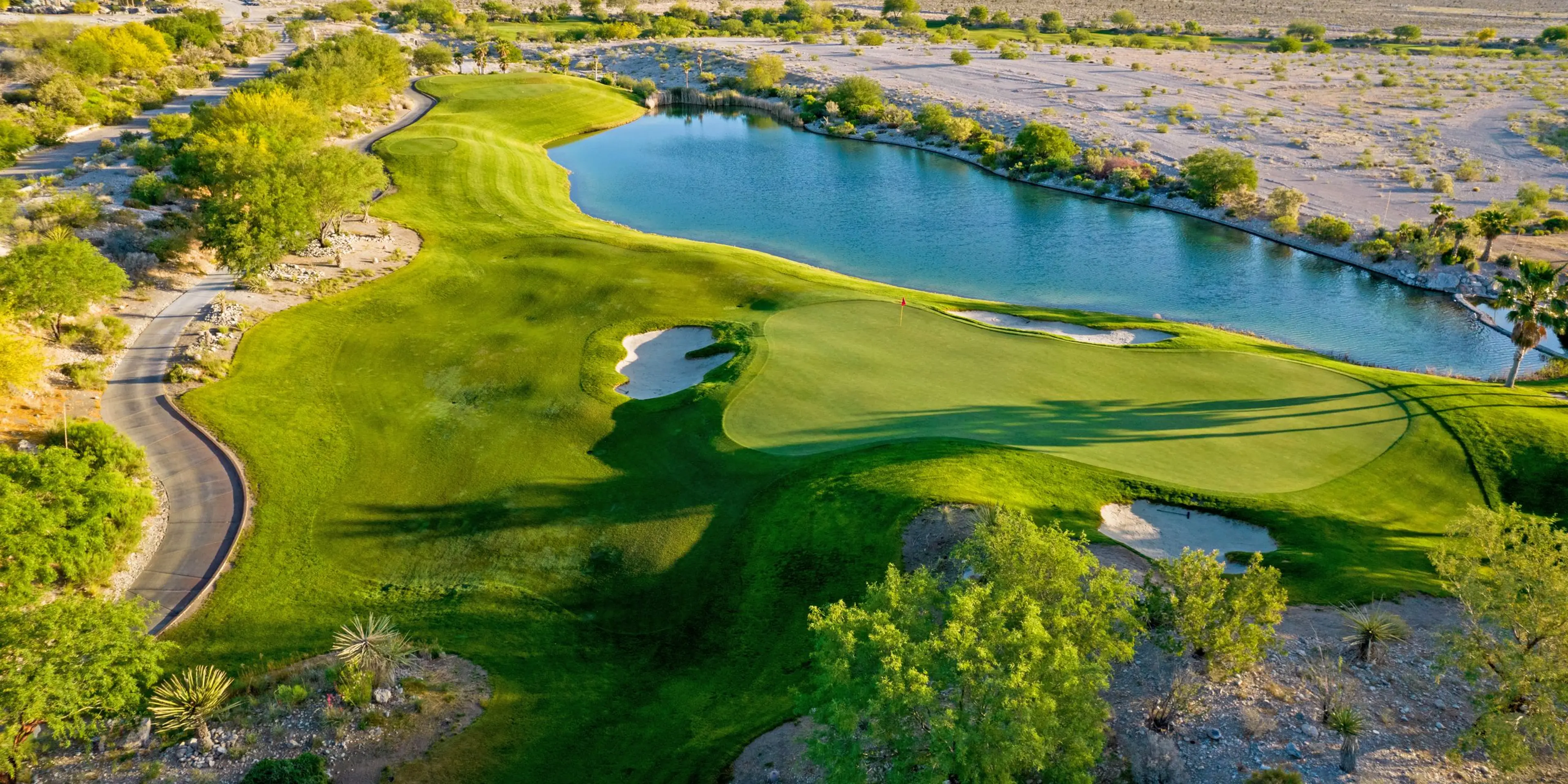 Landscape putting greens and fairway photo of the Coyote Springs Golf Club golf course