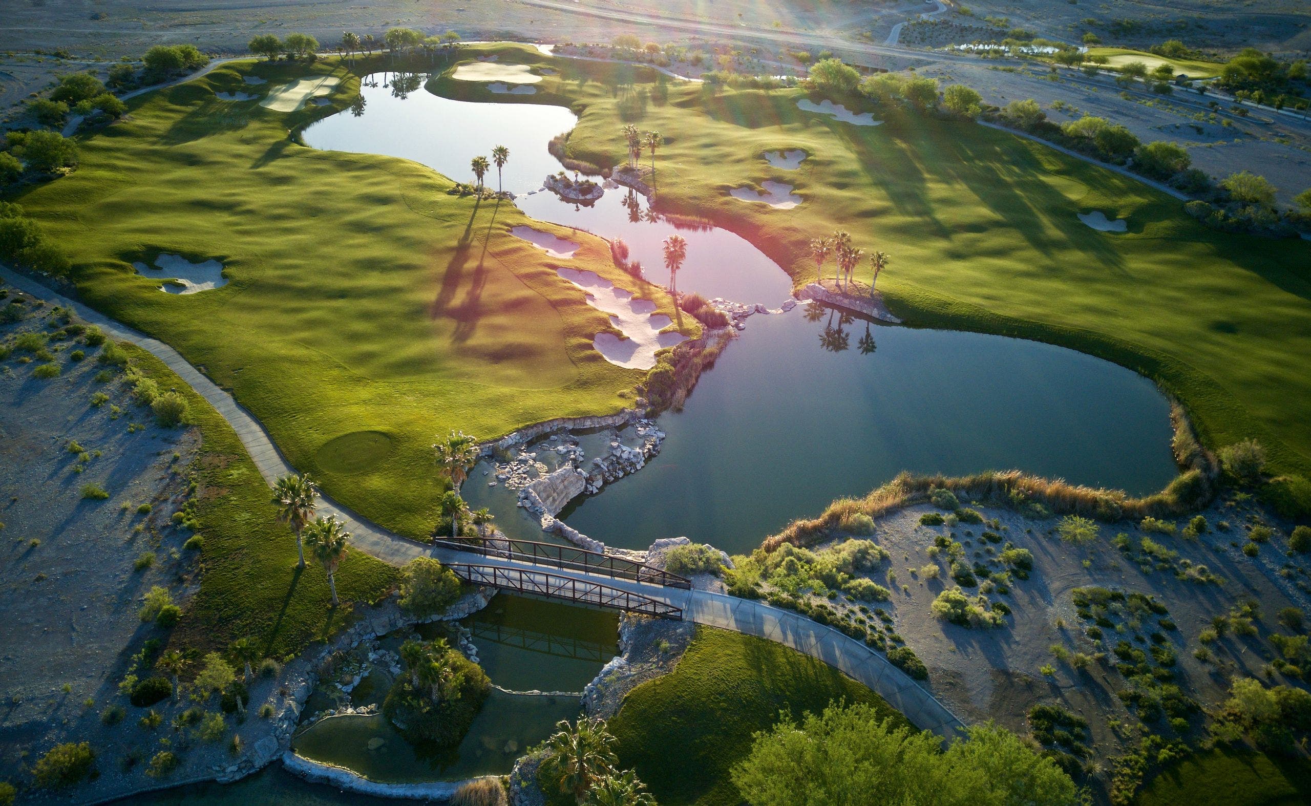 Landscape putting greens and fairway photo of the Coyote Springs Golf Club golf course