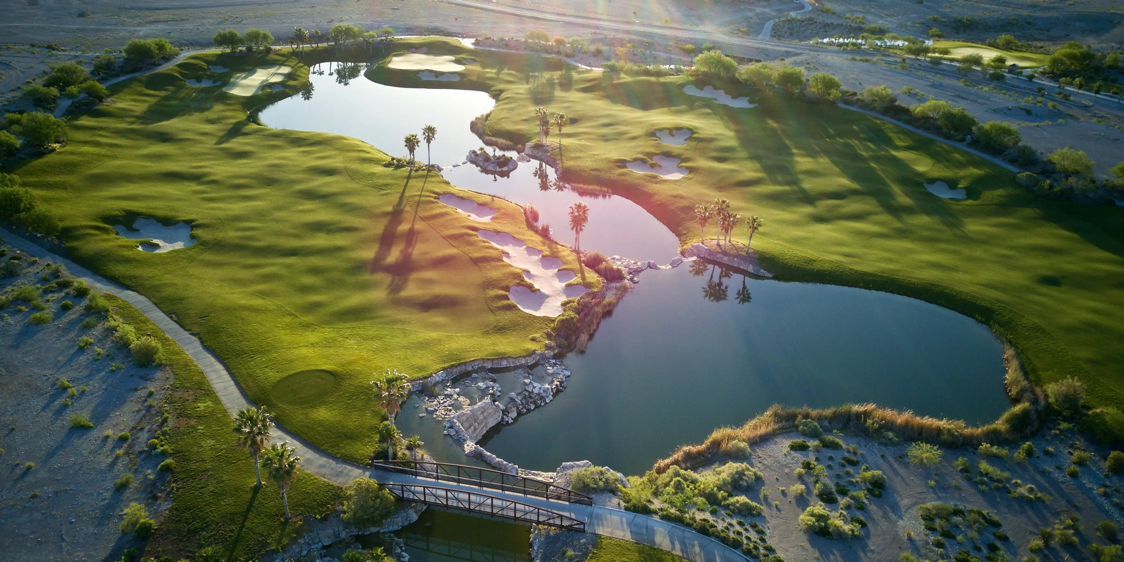 Landscape putting greens and fairway photo of the Coyote Springs Golf Club golf course