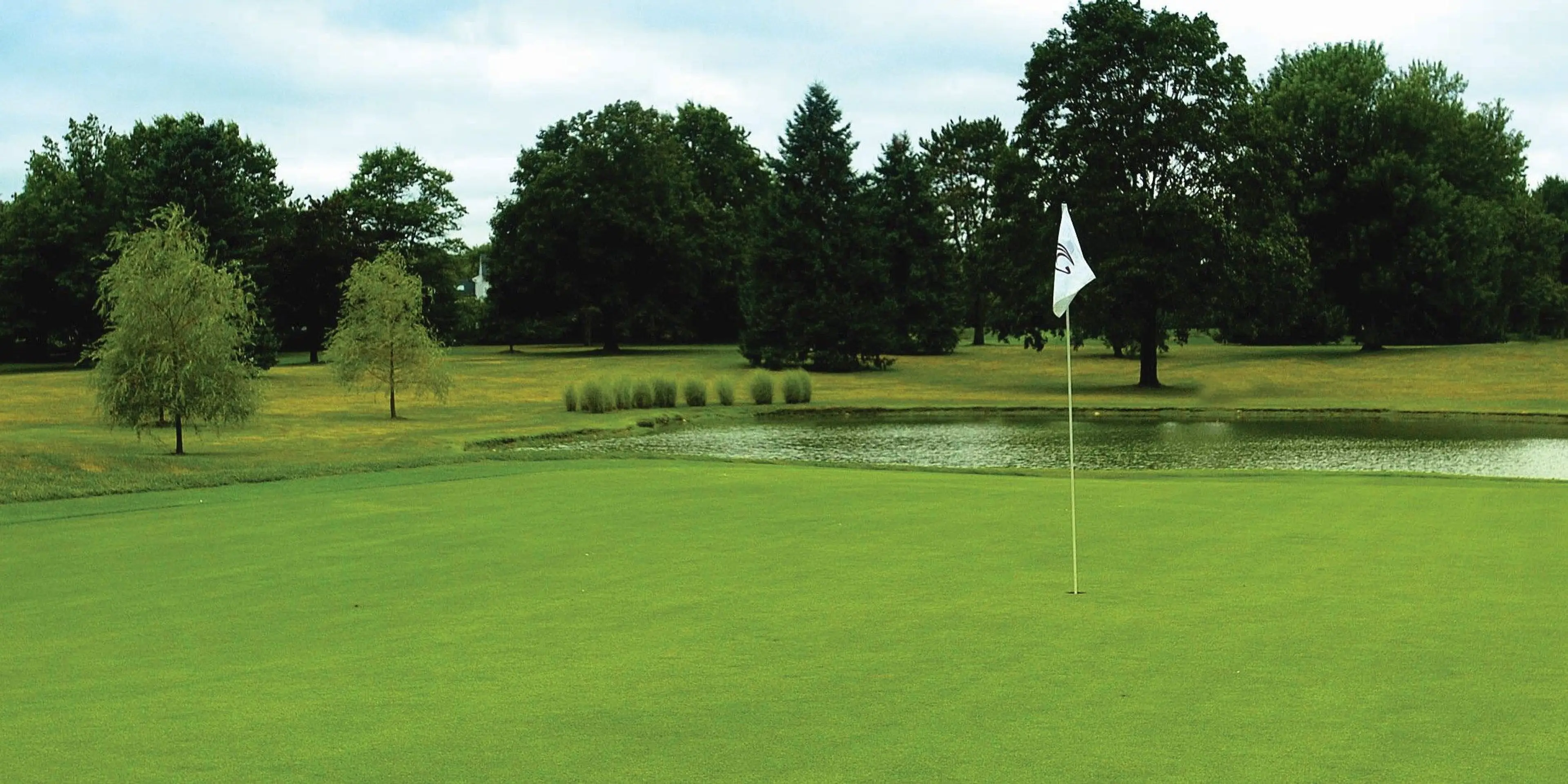Landscape putting greens and fairway photo of the Cranbury Golf Club golf course