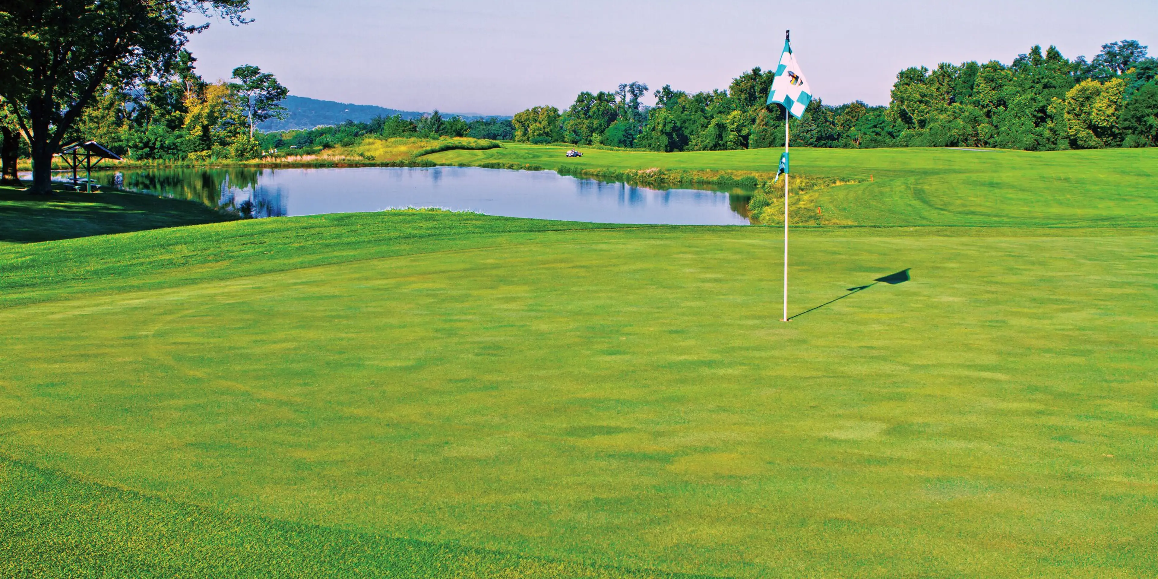Landscape putting greens and fairway photo of the Dauphin Highlands Golf Course golf course