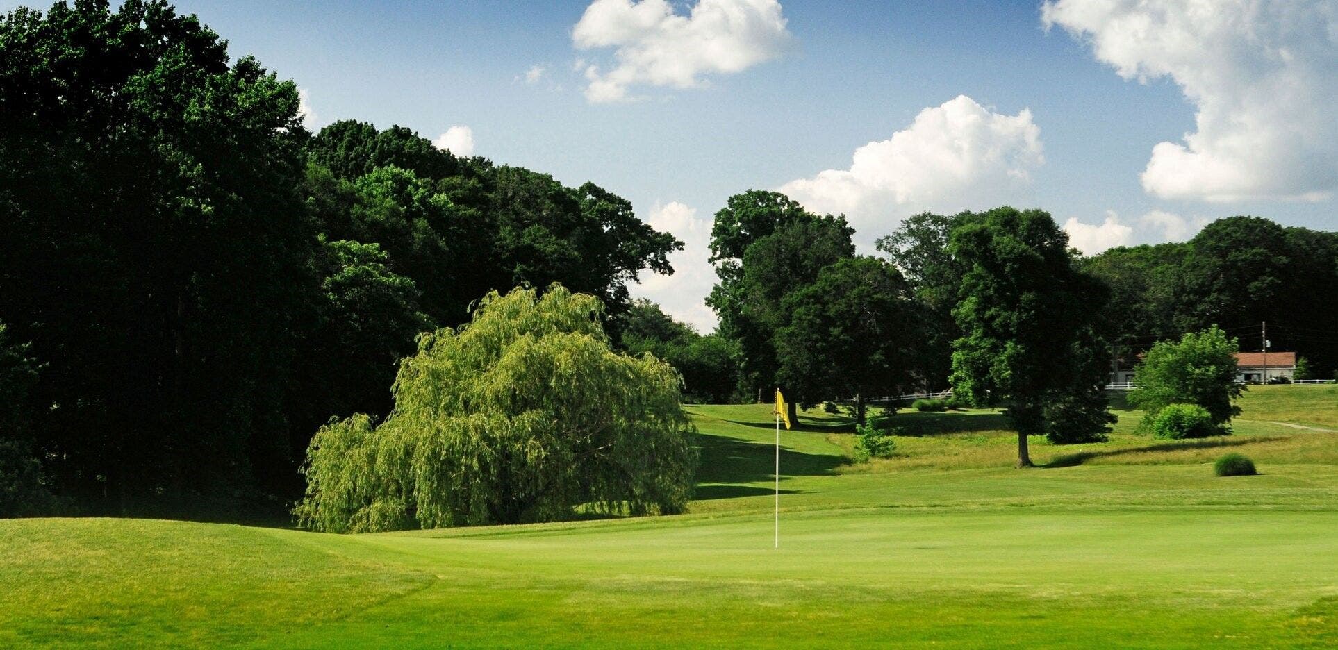 Landscape putting greens and fairway photo of the Delcastle Golf Club golf course