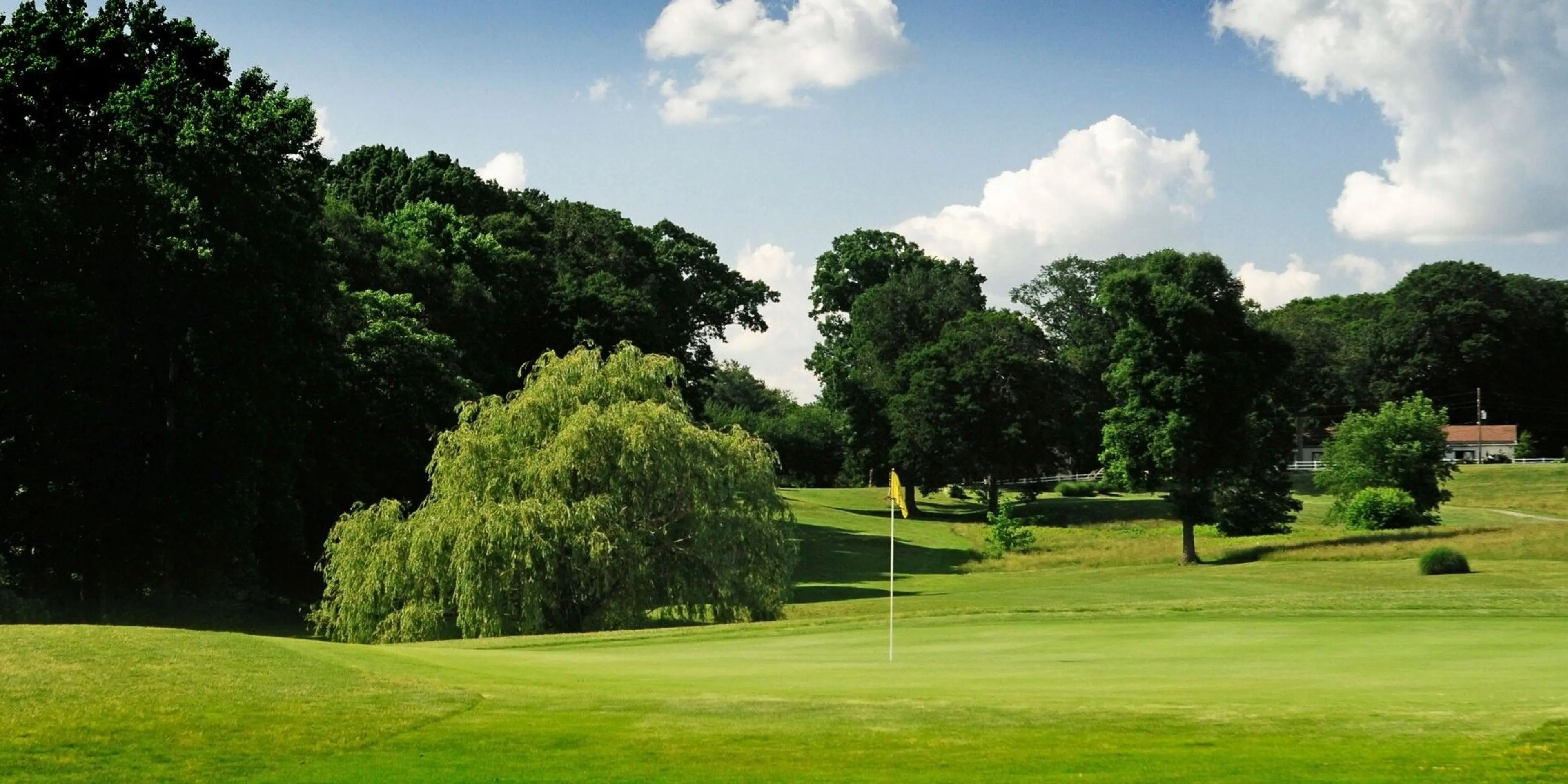 Landscape putting greens and fairway photo of the Delcastle Golf Club golf course