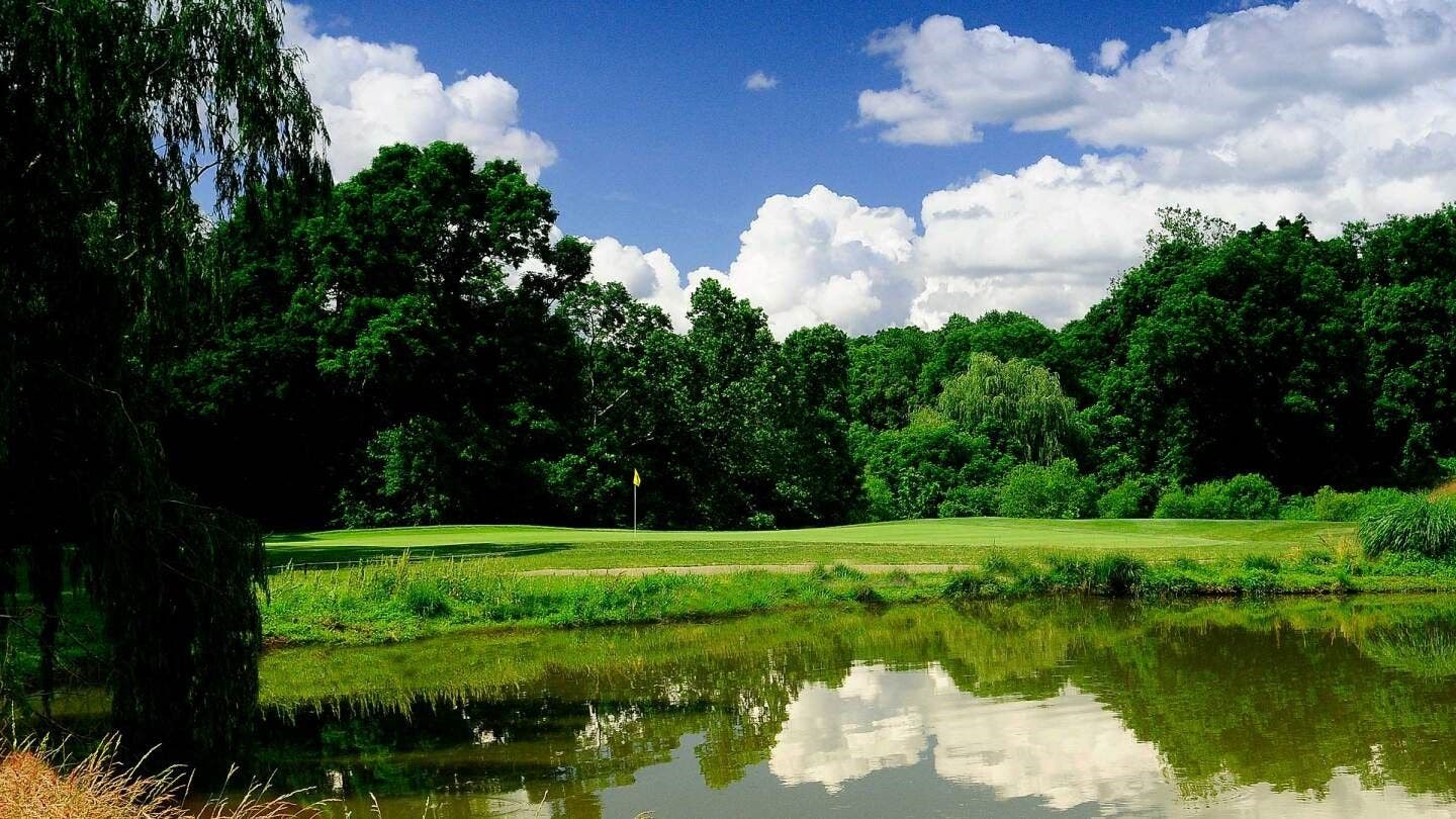 Landscape putting greens and fairway photo of the Delcastle Golf Club golf course