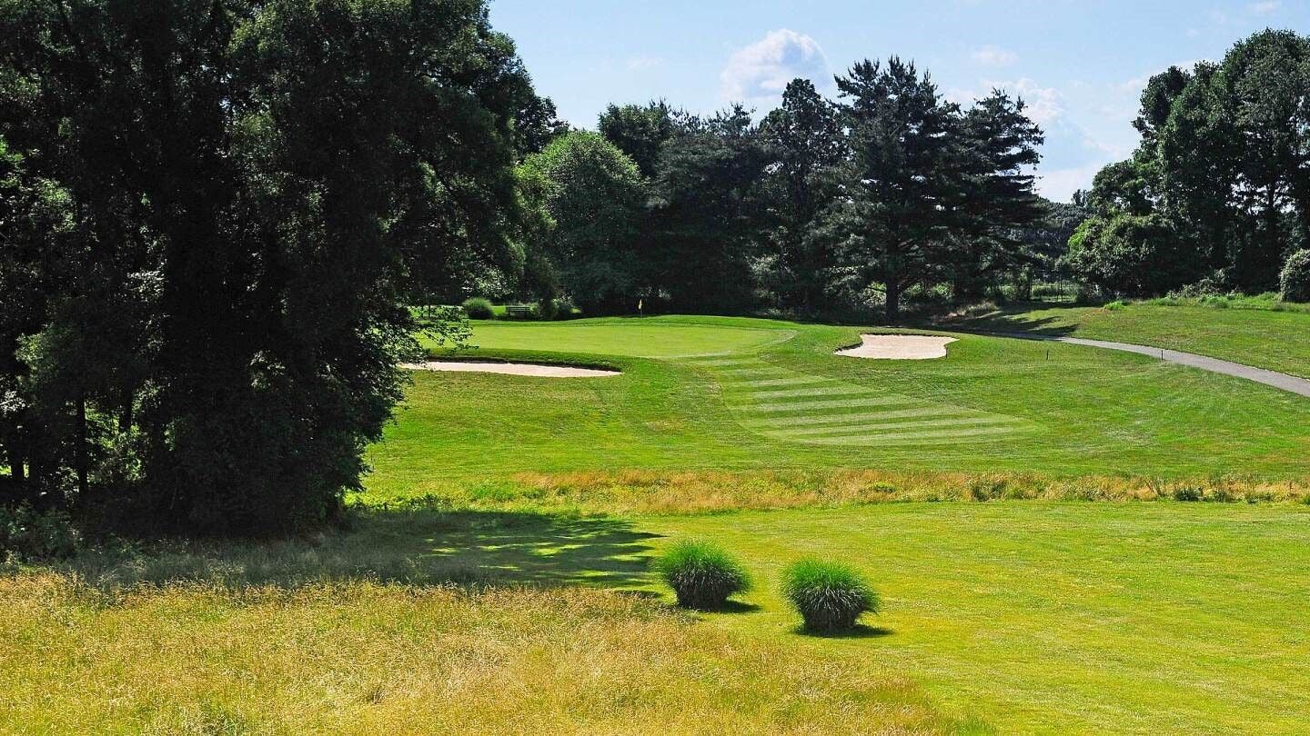 Landscape putting greens and fairway photo of the Delcastle Golf Club golf course