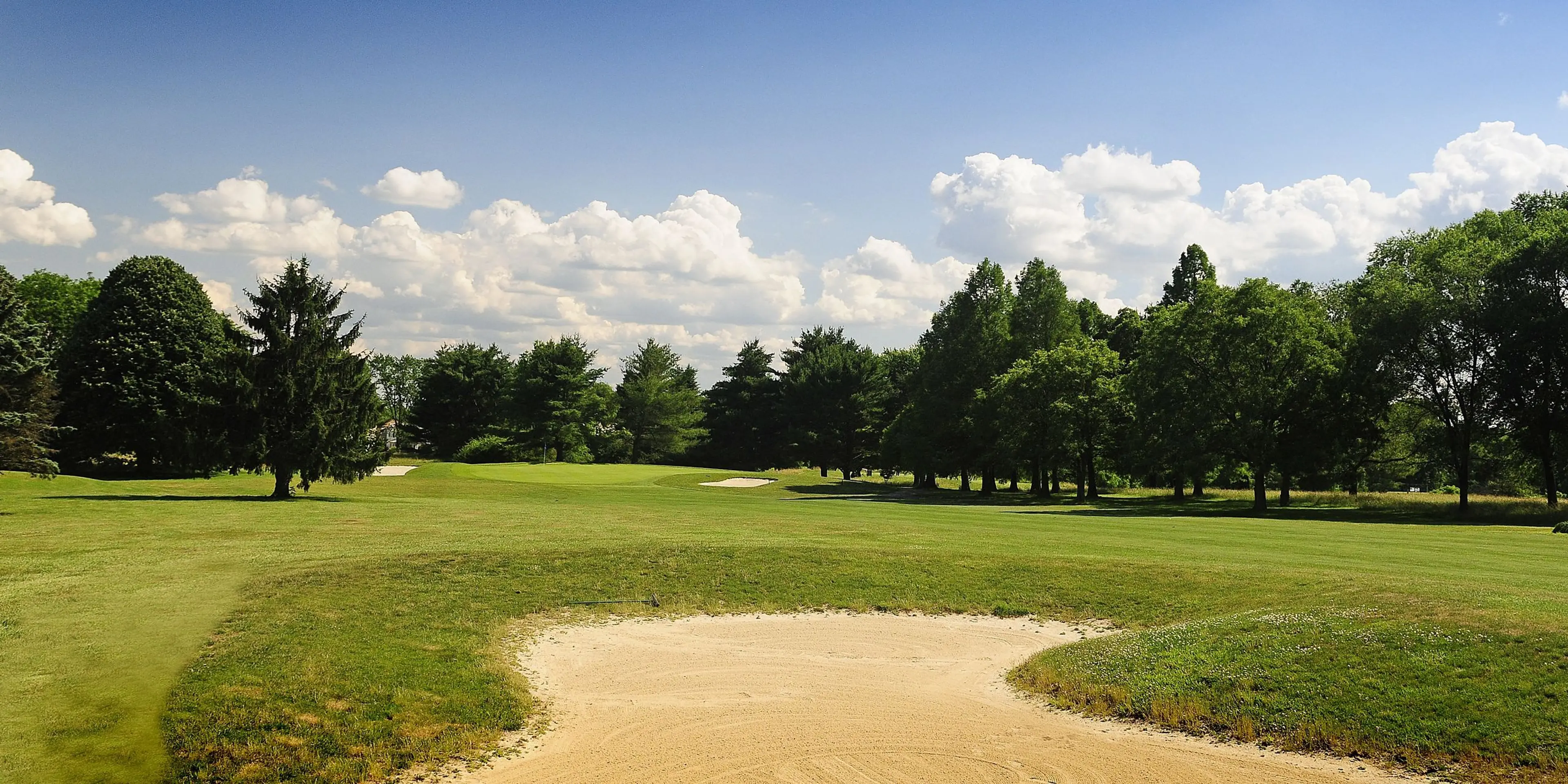 Landscape putting greens and fairway photo of the Delcastle Golf Club golf course