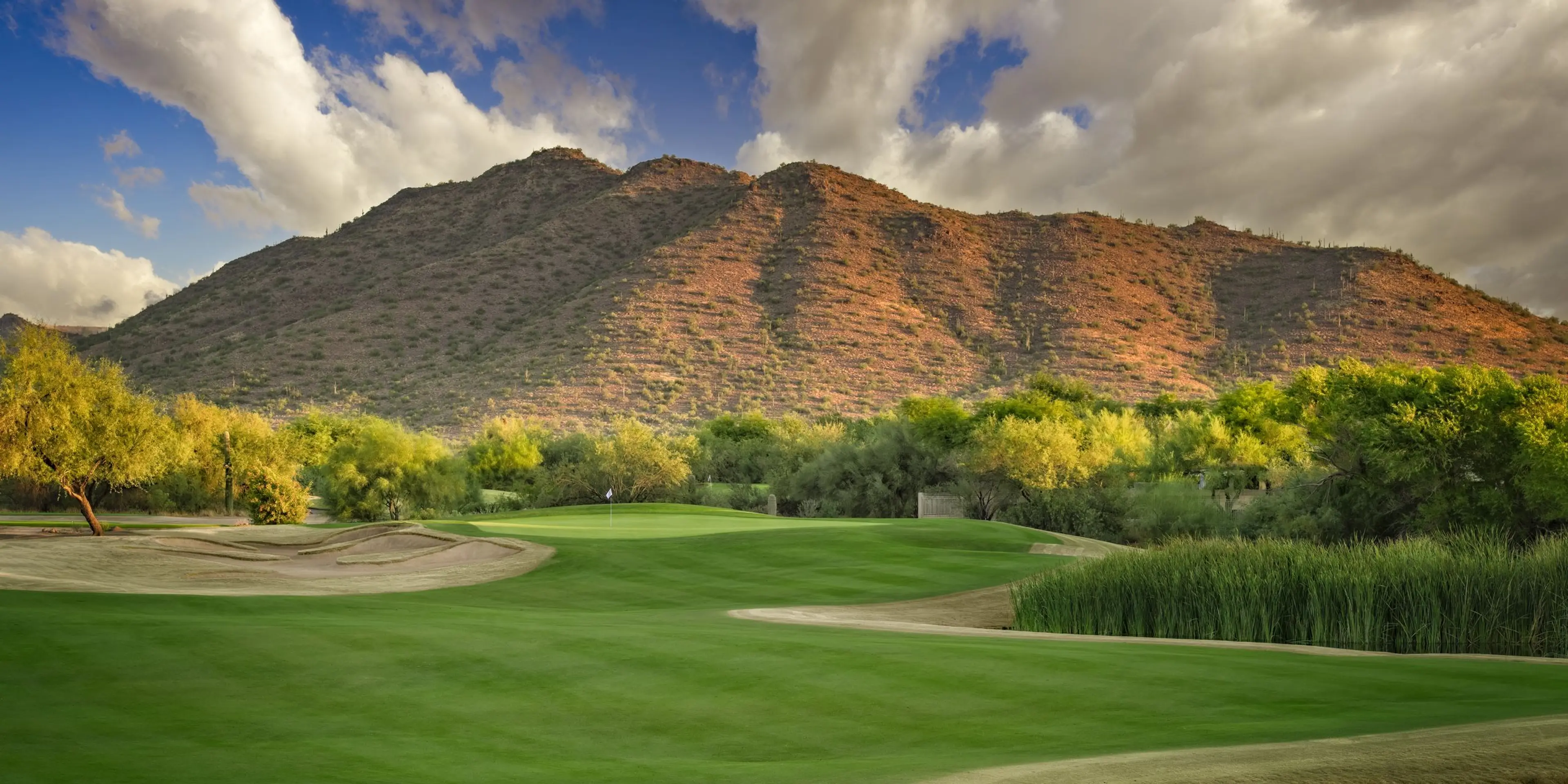 Landscape putting greens and fairway photo of the Dove Valley Ranch Golf Club golf course