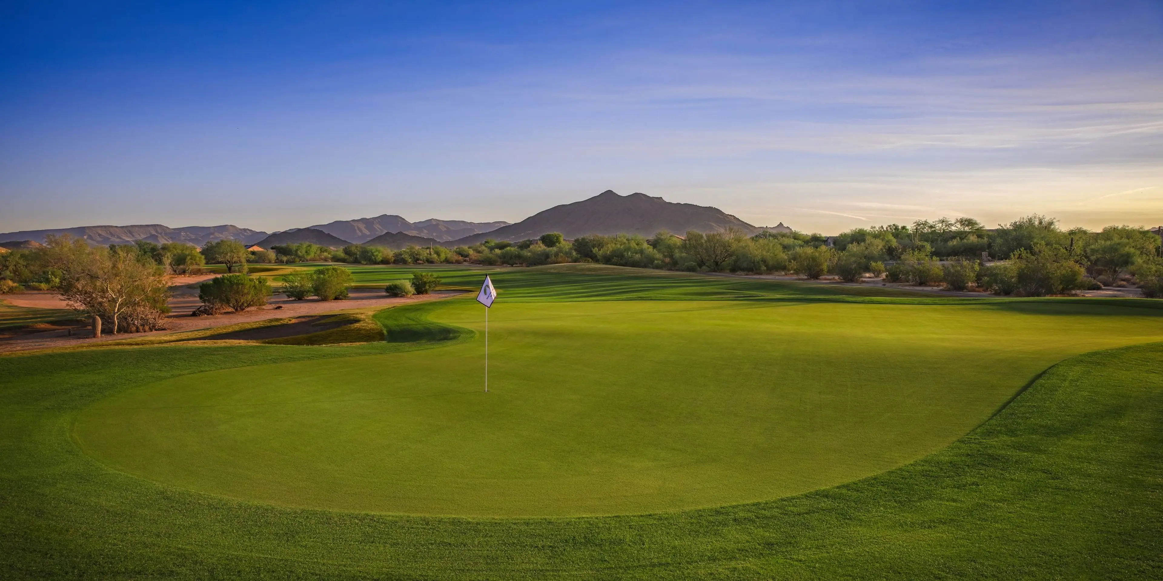 Landscape putting greens and fairway photo of the Dove Valley Ranch Golf Club golf course