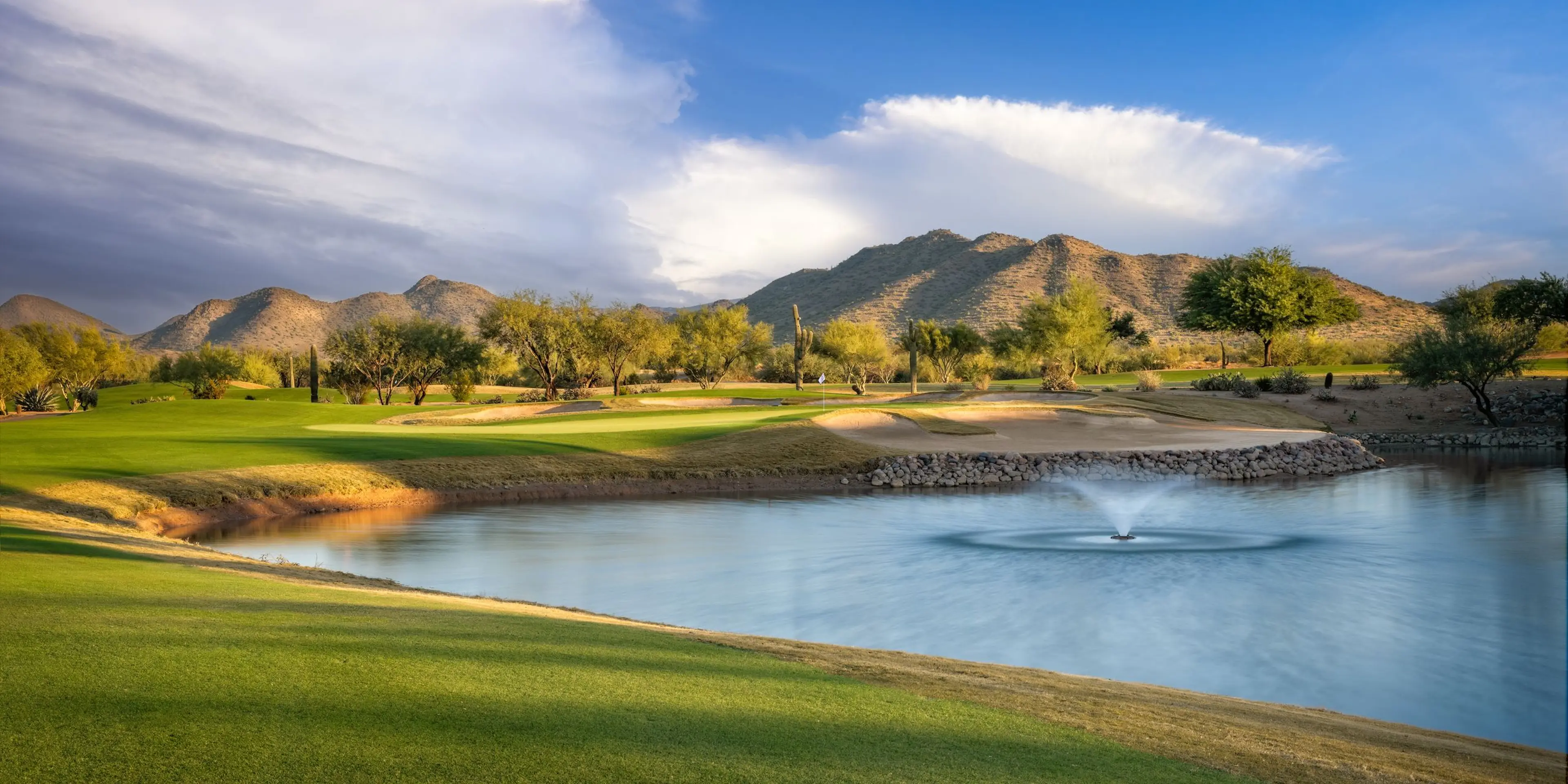 Landscape putting greens and fairway photo of the Dove Valley Ranch Golf Club golf course