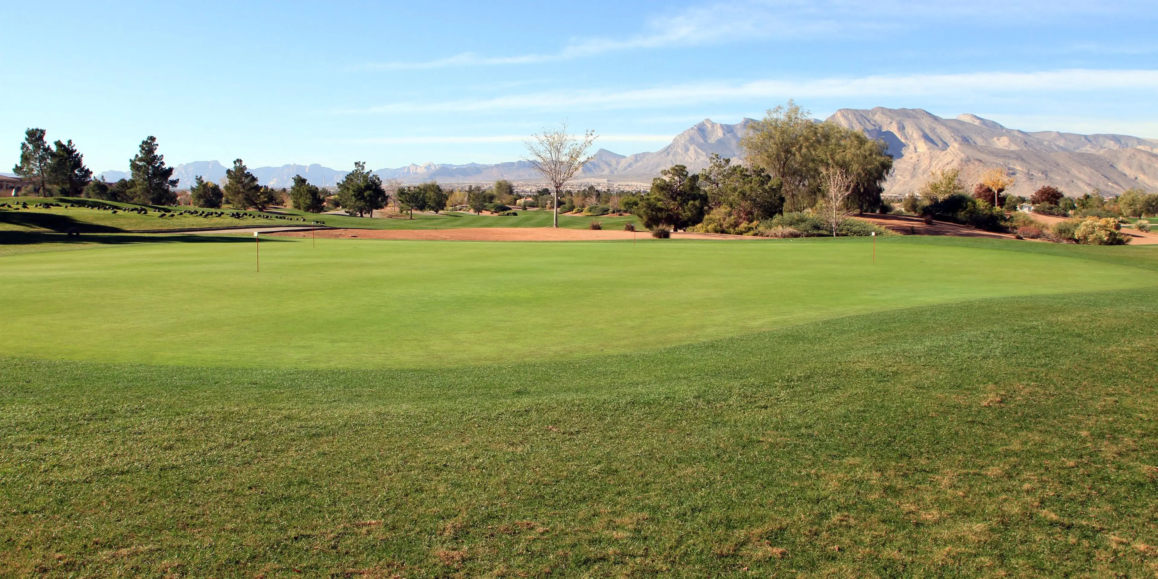 Landscape putting greens and fairway photo of the Durango Hills Golf Club golf course