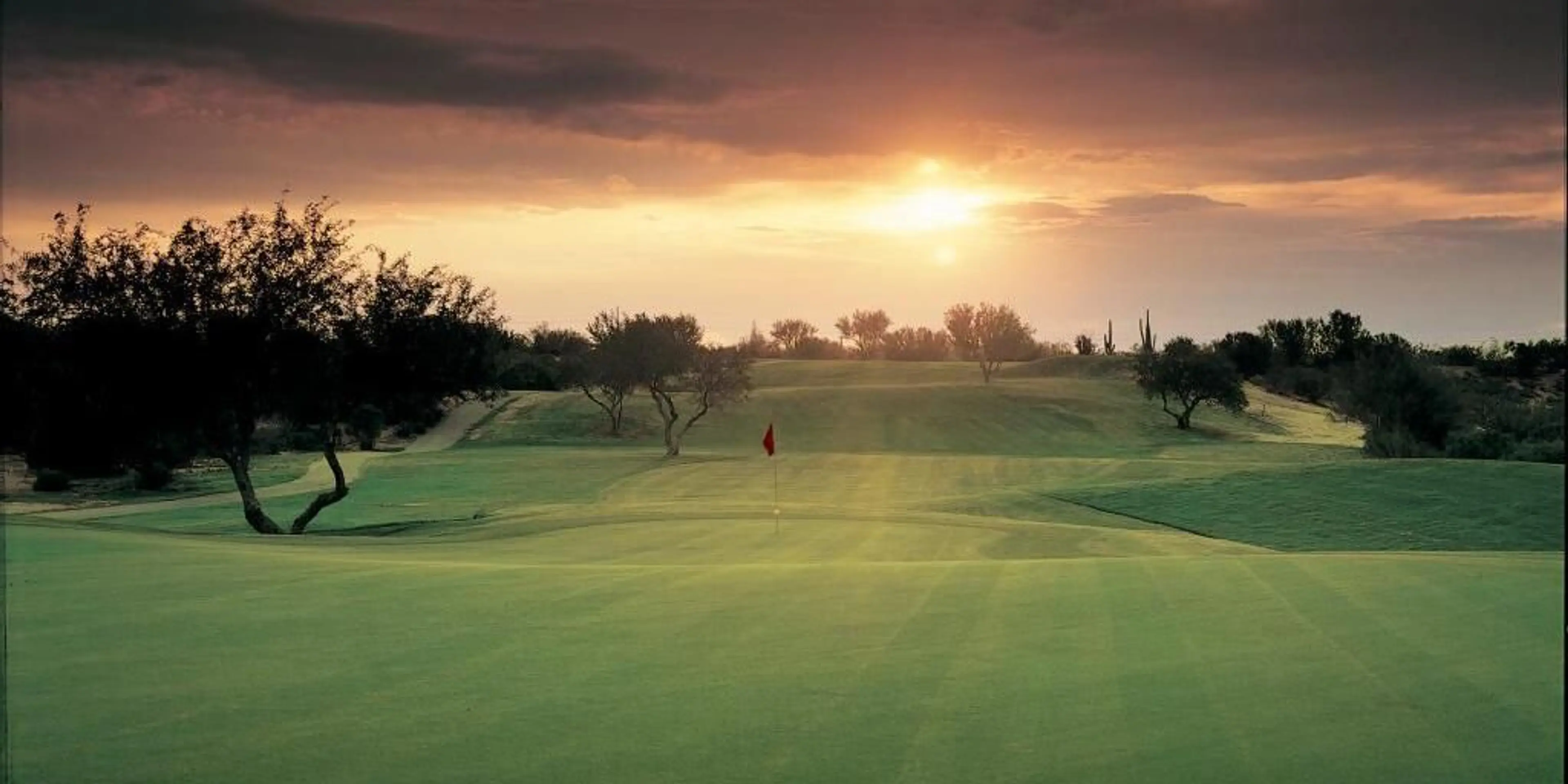 Landscape putting greens and fairway photo of the El Conquistador Golf Club golf course